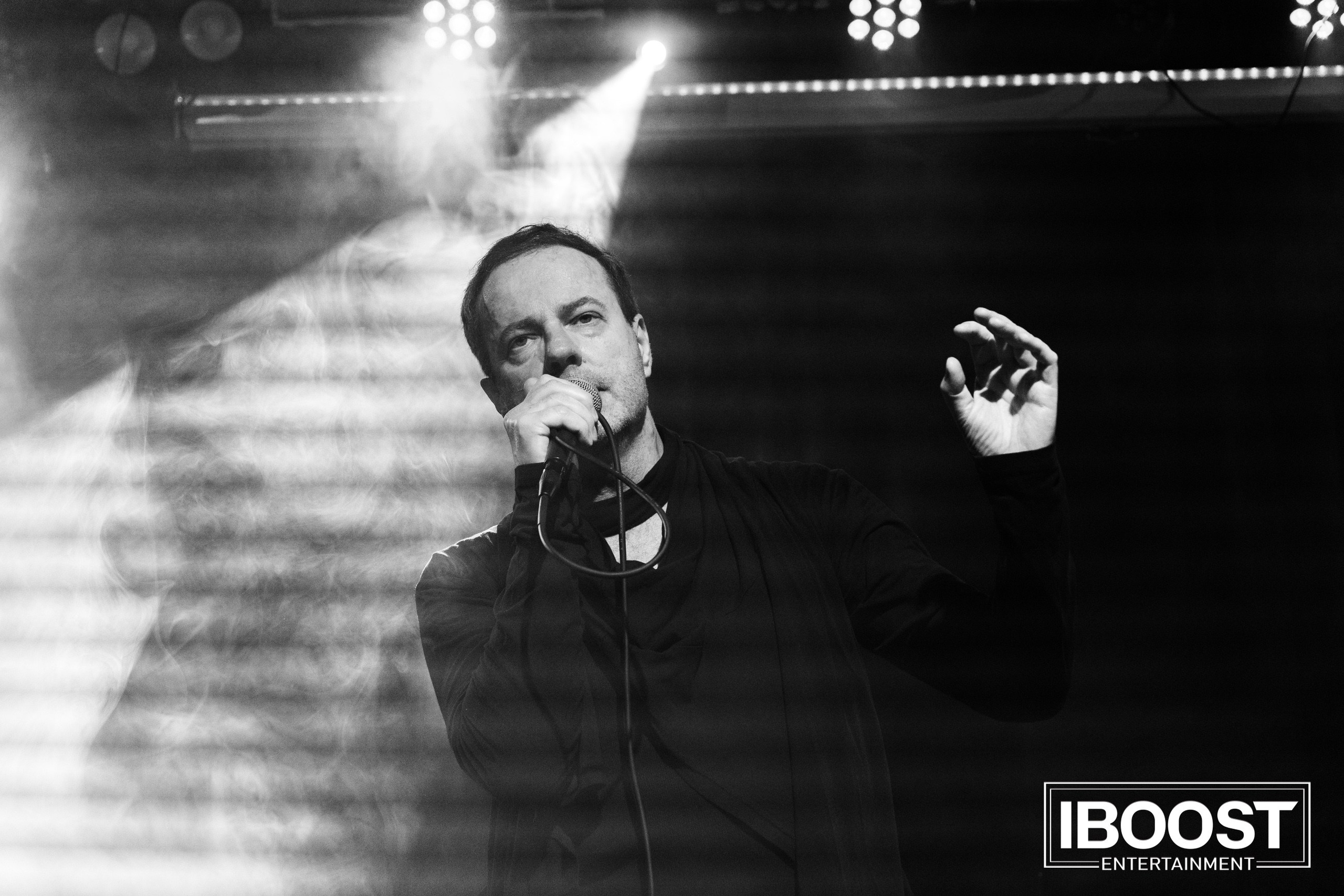 Black-and-white portrait of vocalist Krasovitsky singing under stage lights during the Animal JazZ concert in Sofia.