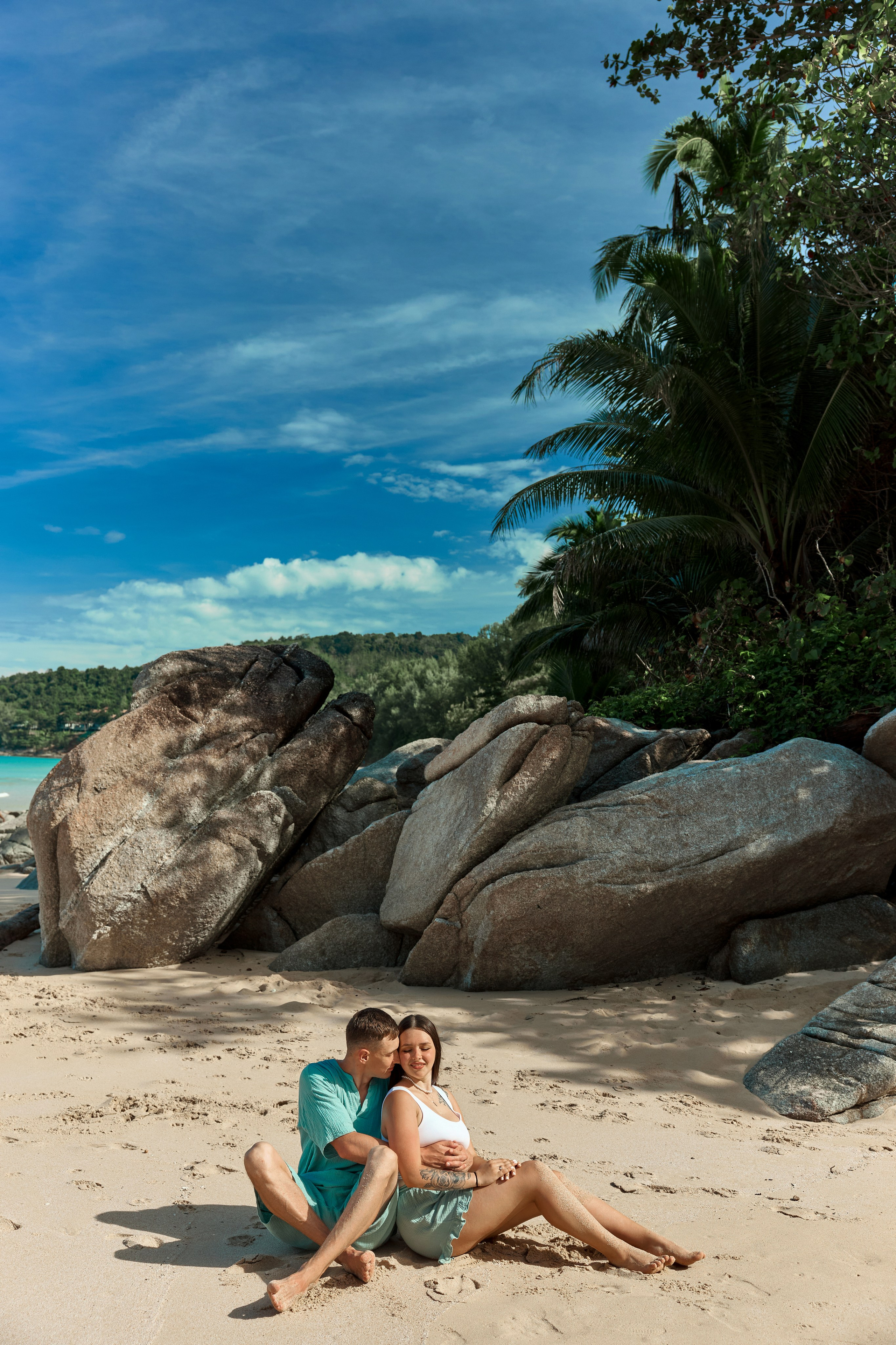 Romantic couples photoshoot on coastal rocks at Naithon Beach Phuket
