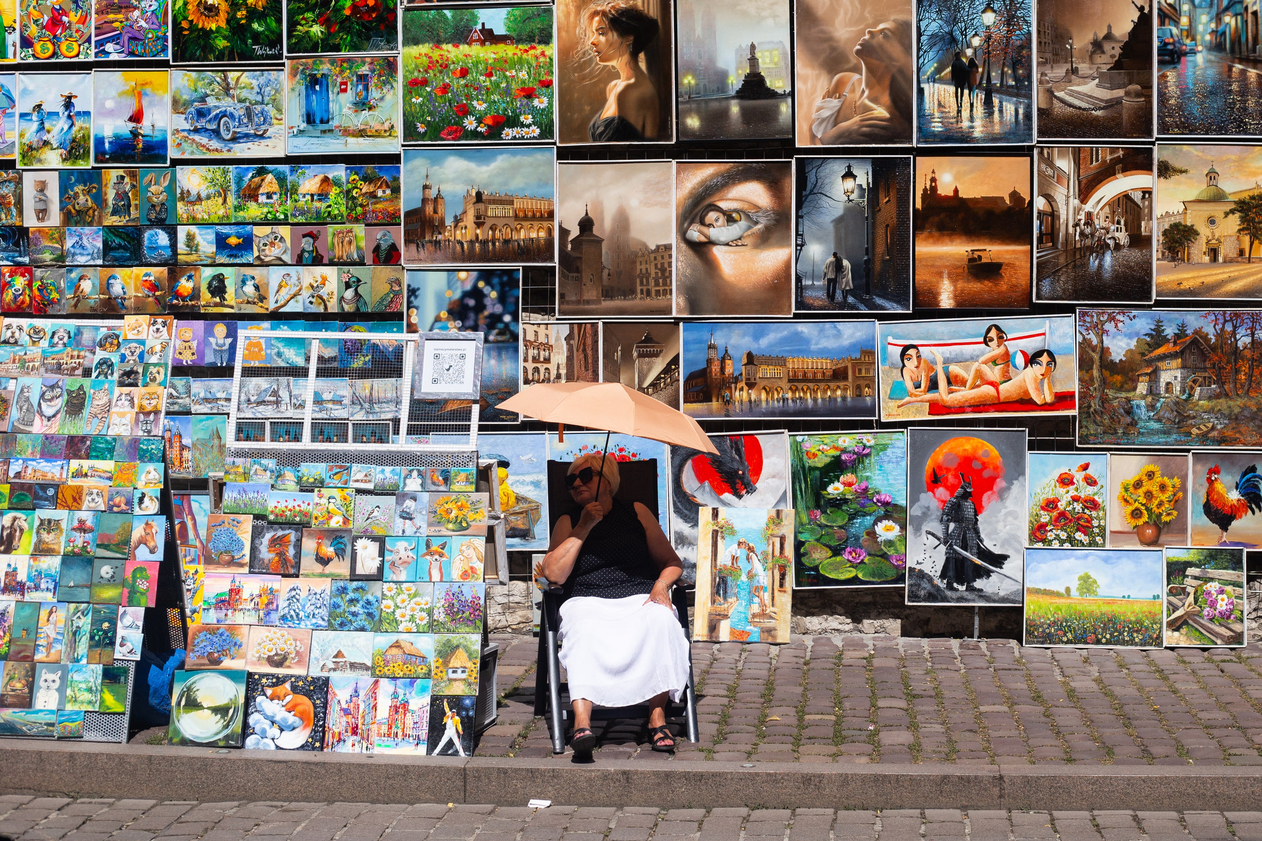 The painting seller is hiding from the sun. | Kraków 2026 | CANON 6D