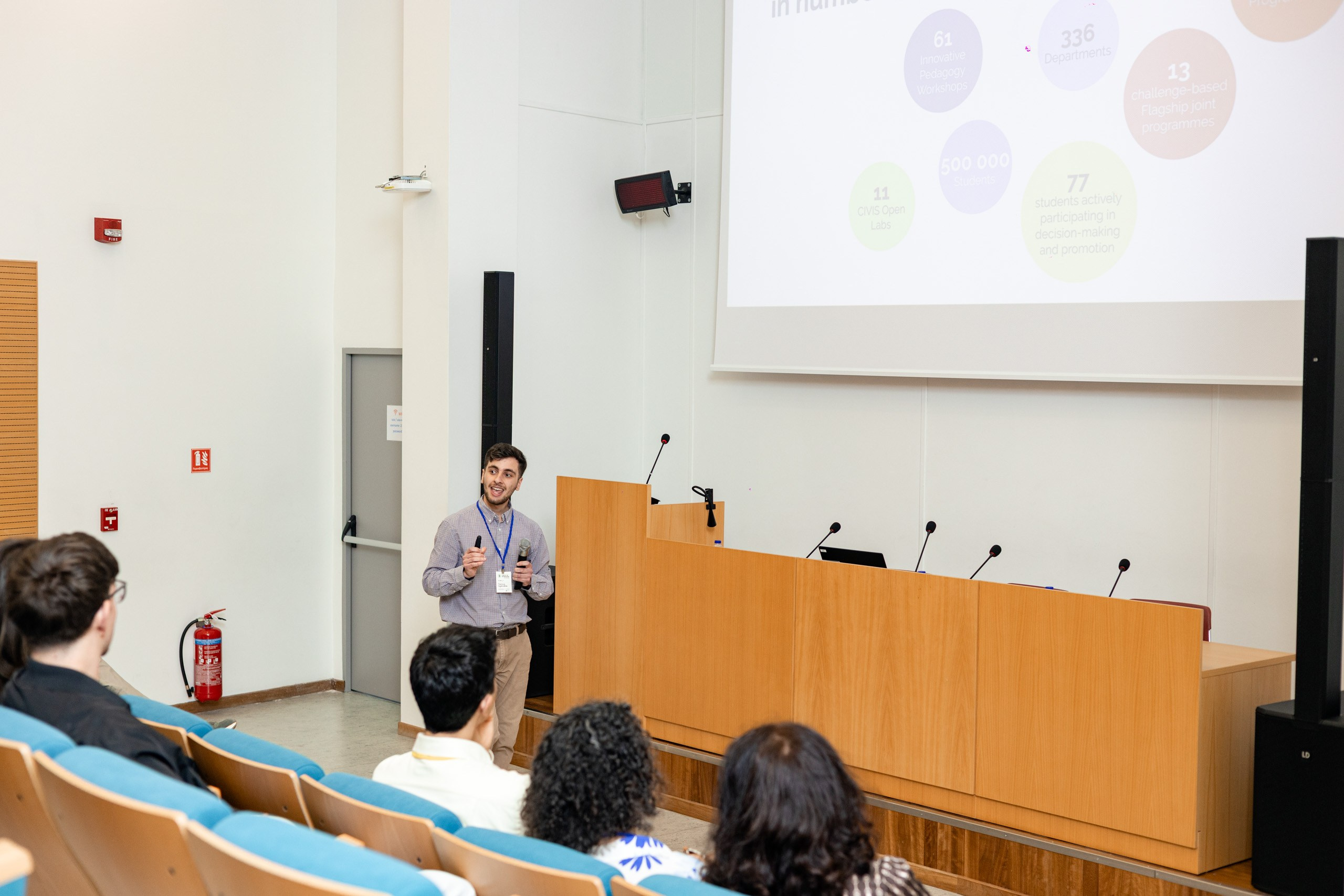 Speakers presenting during an academic conference