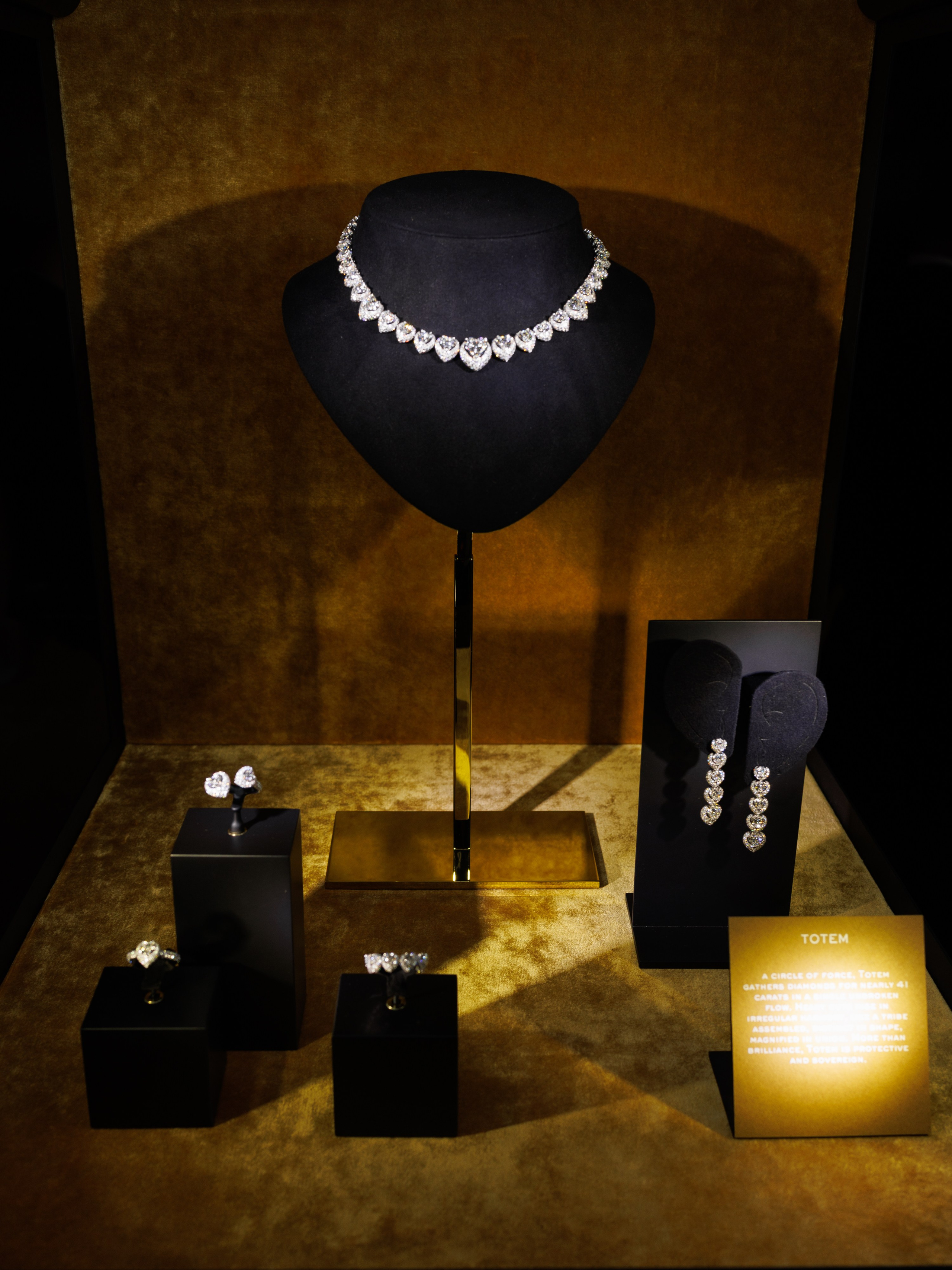 Jewelry display with dramatic warm lighting – luxury product photo