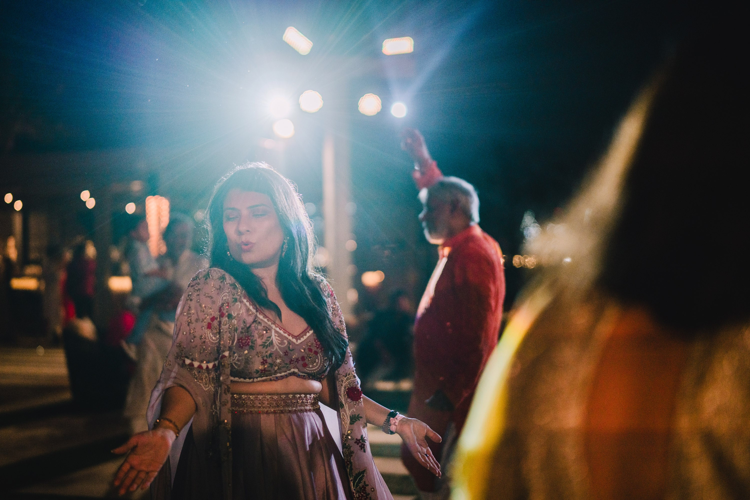 Indian lady in a bright light dancing national dance