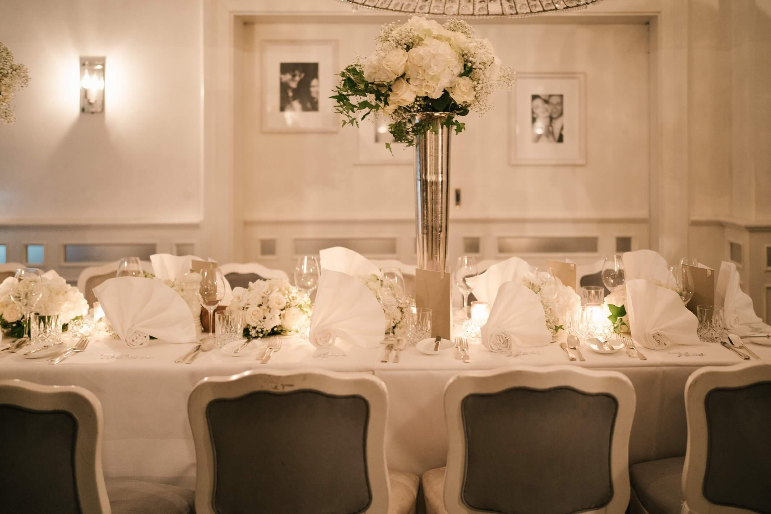 Reception table setup with floral centerpiece at Käfer Stammhaus Munich