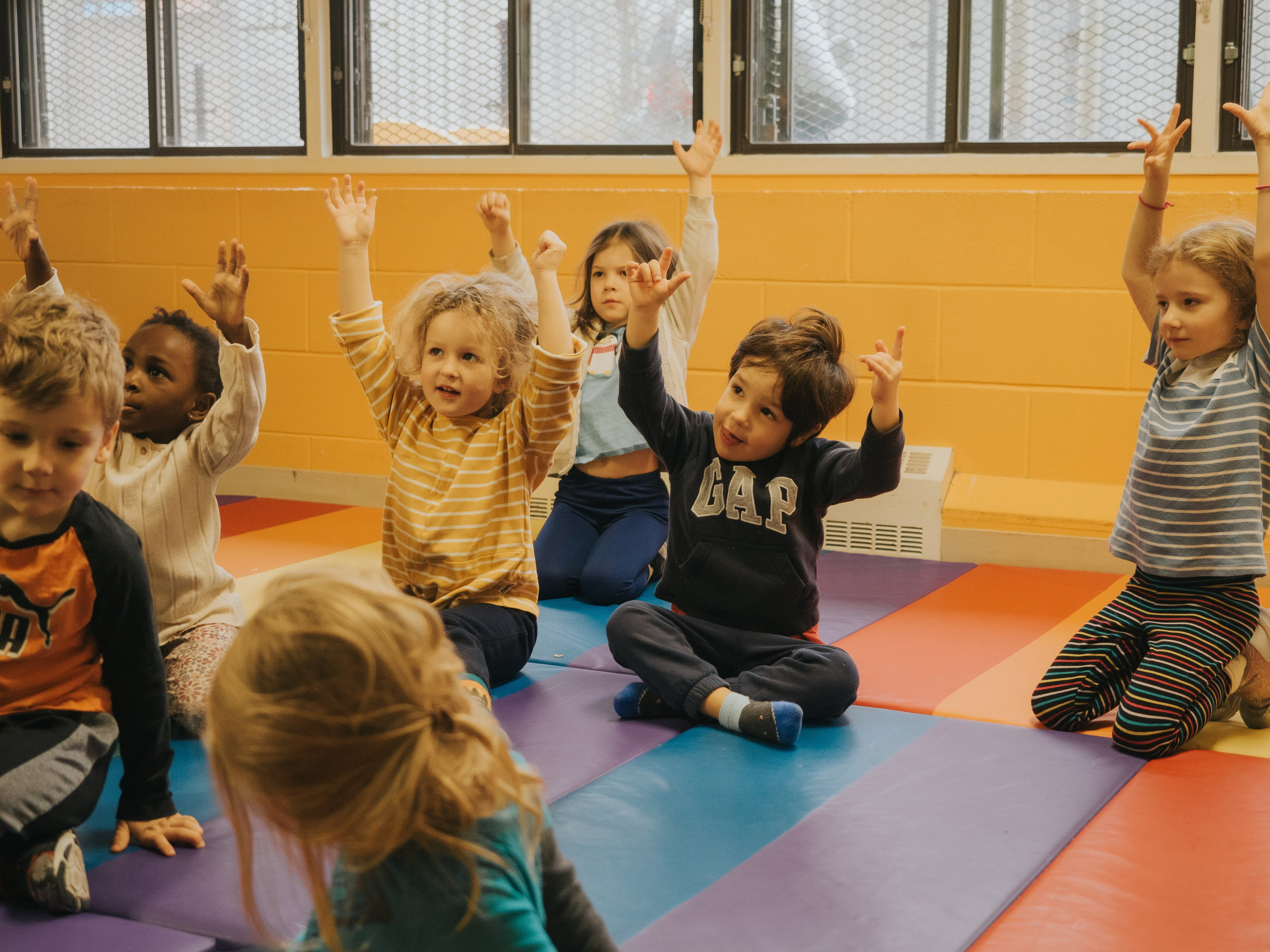 Children with their hands in the air.