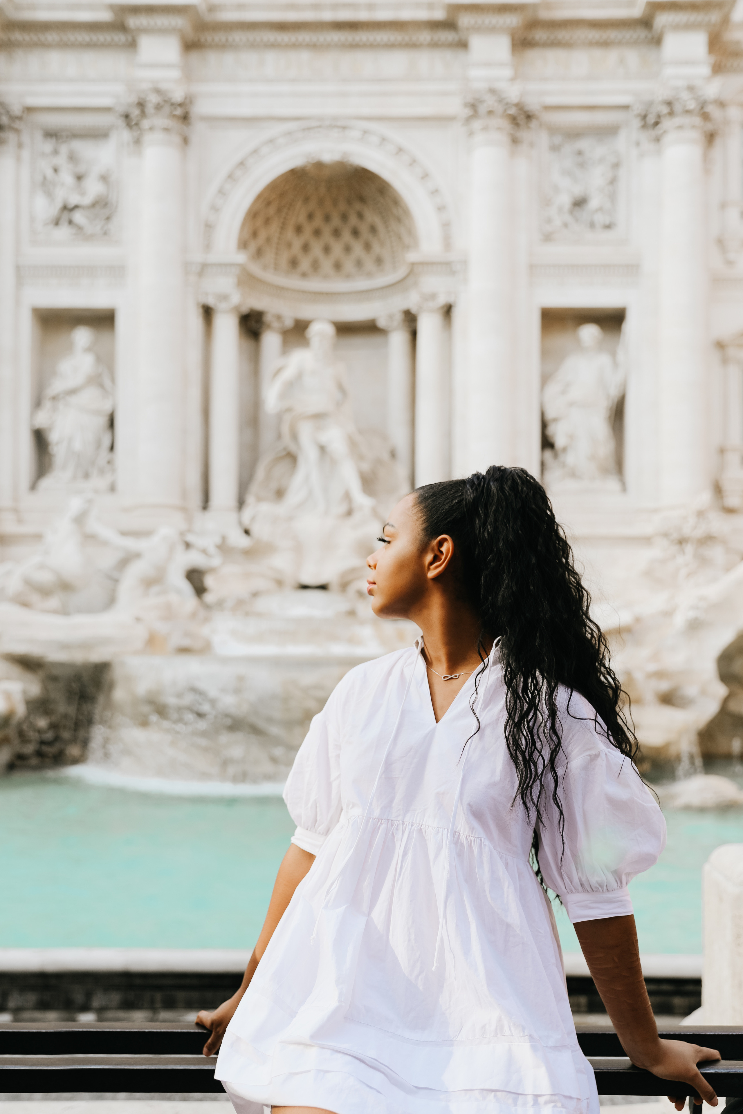 THREE COINS IN THE TREVI FOUNTAIN. Photographer in Rome