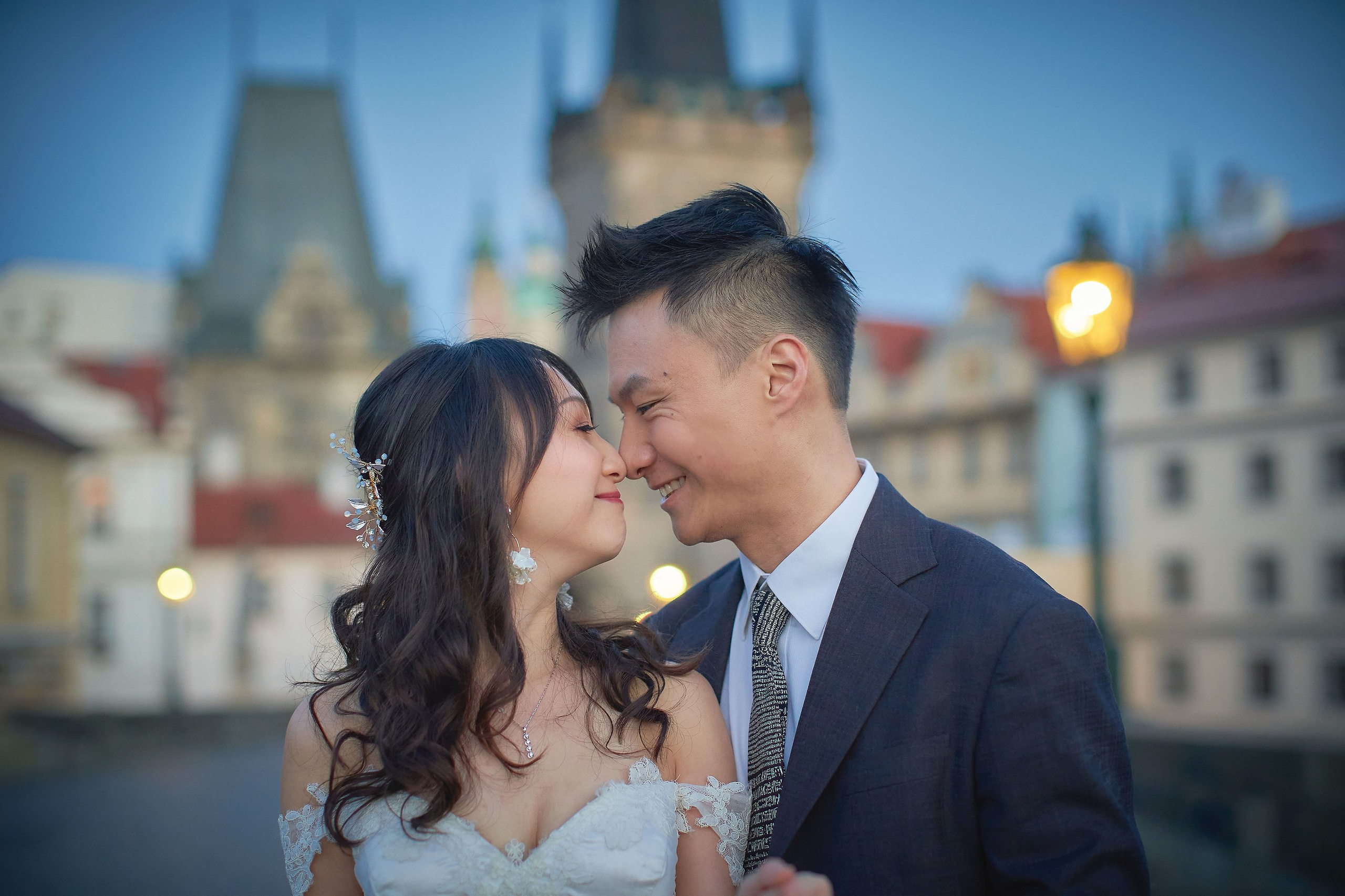 Eva and Conan, rubbing noses playfully onthe empty Charles Bridge at sunrise, Prague.