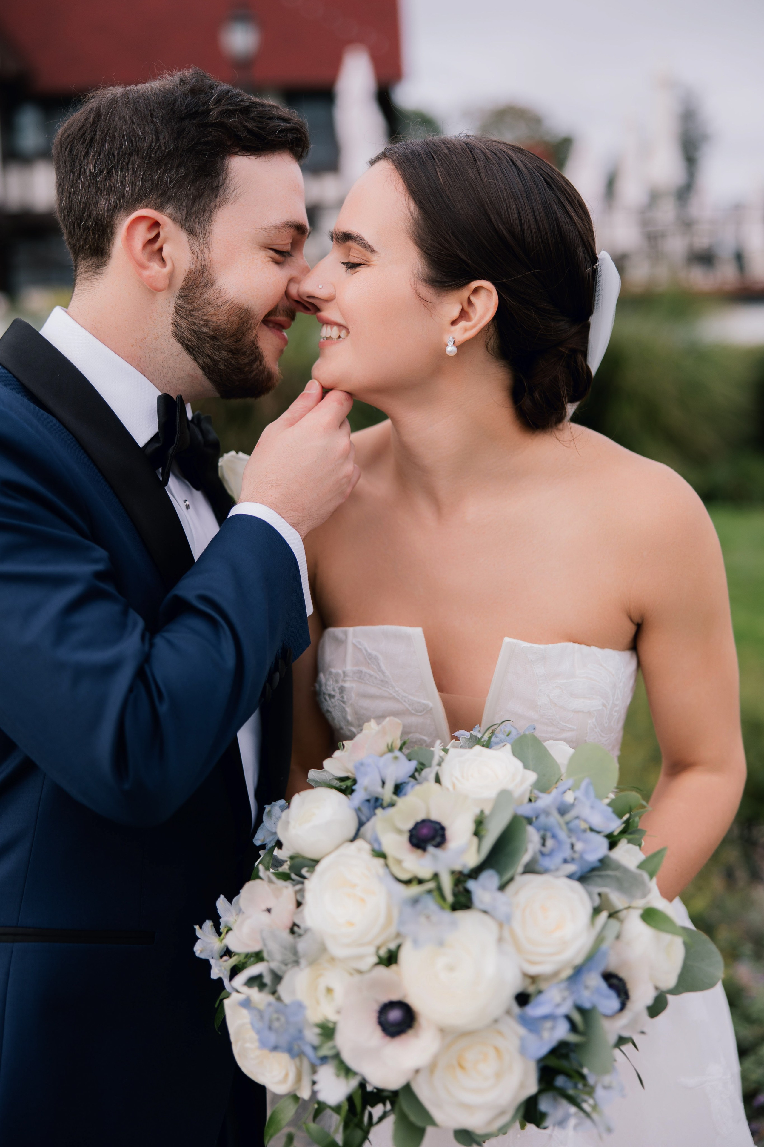a bride and groom share a kiss