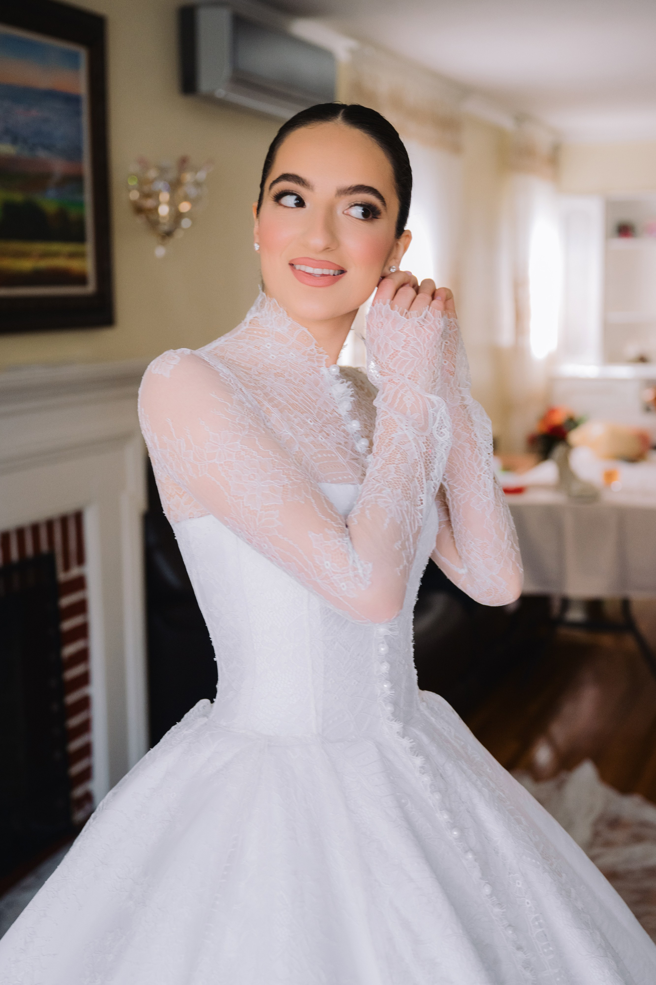 a woman in a white wedding dress posing for a photo