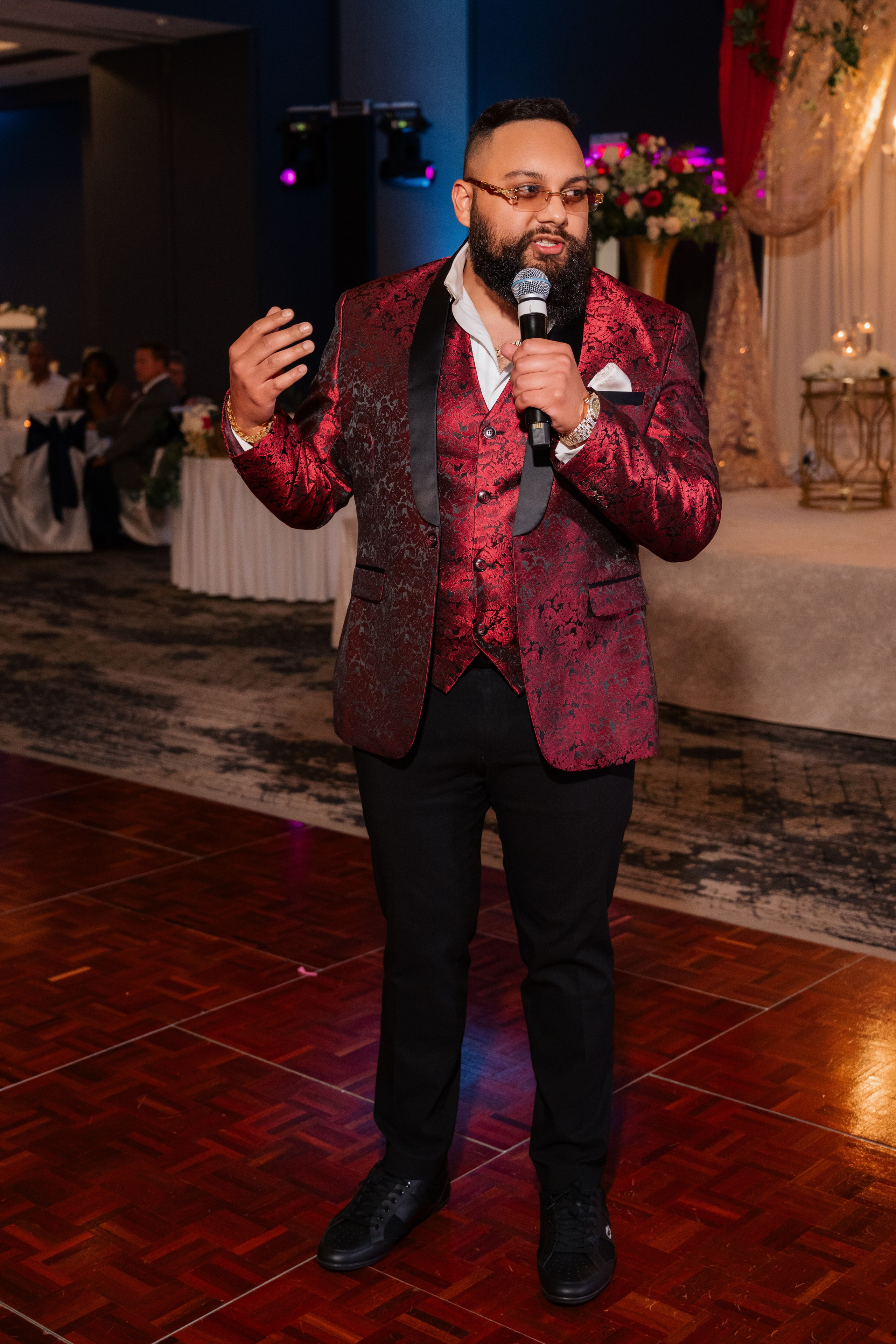 a man in a red jacket and black pants