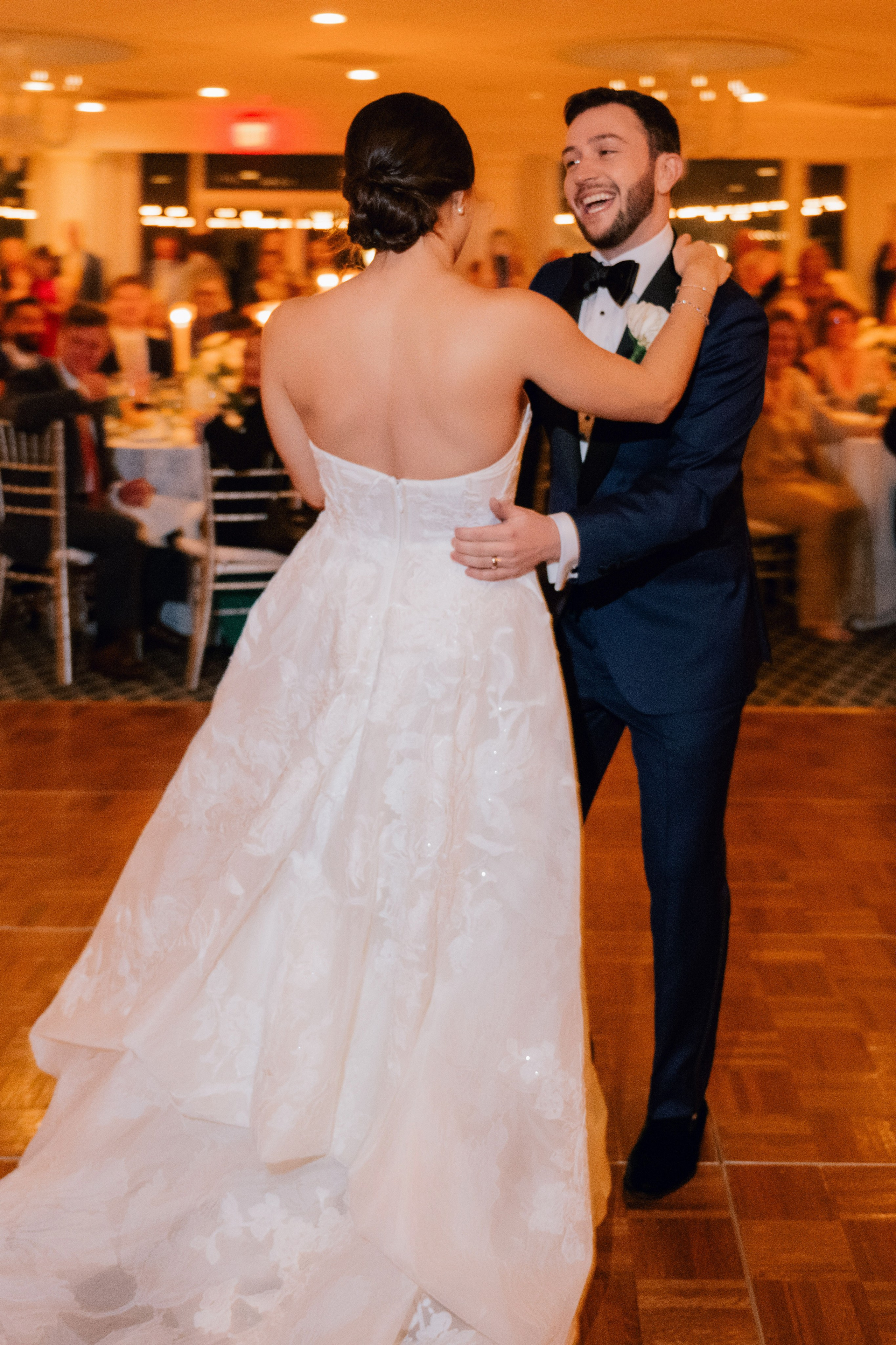 a bride and groom dancing at a wedding reception