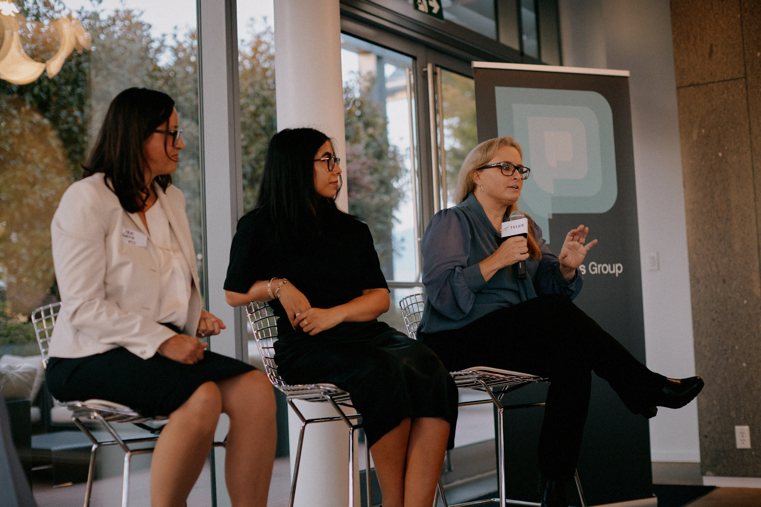 Three panelists on stage during The Career Curve discussion at the PayTech Women Vancouver chapter launch
