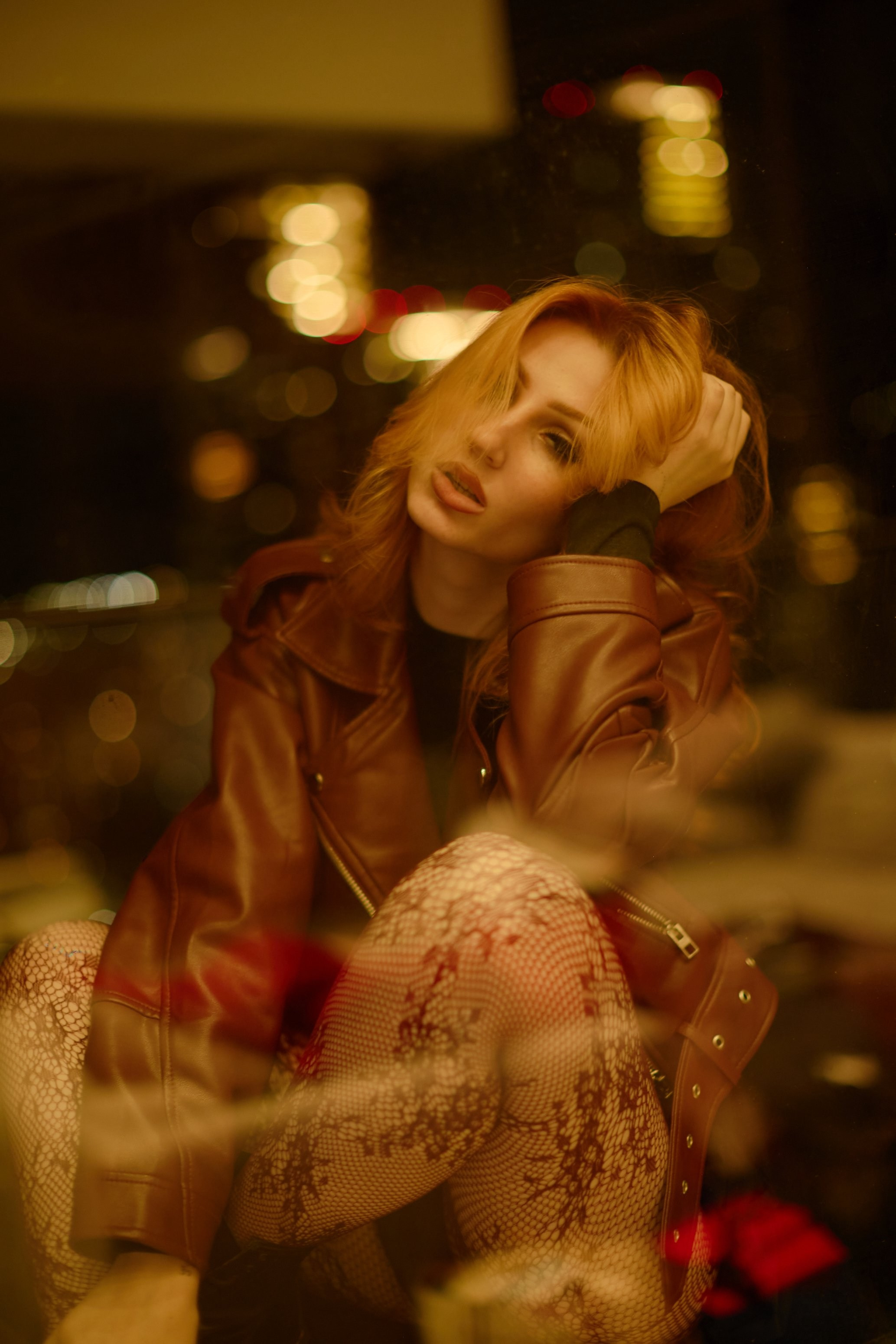 Woman with long red hair in warm golden light, framed by soft bokeh — fall fashion portrait at OCCASION Photo Day, Coquitlam