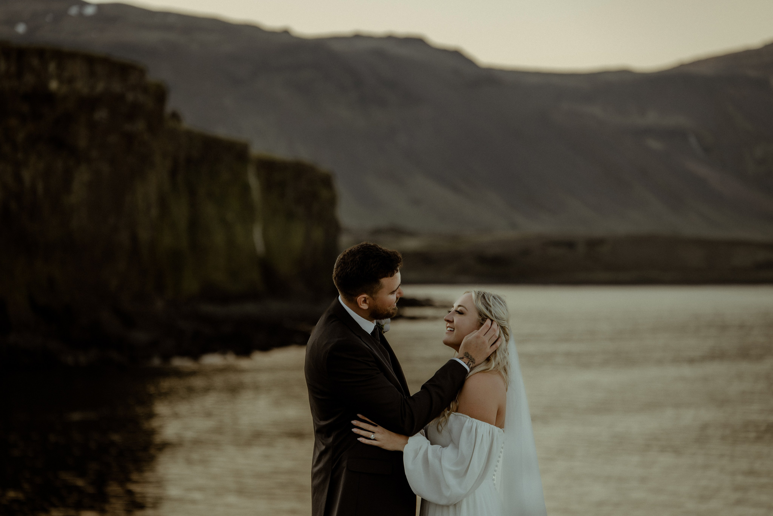 Iceland elopement at Budir with midnight sun wedding photos at black sand beach. Iceland elopement photographer & videographer