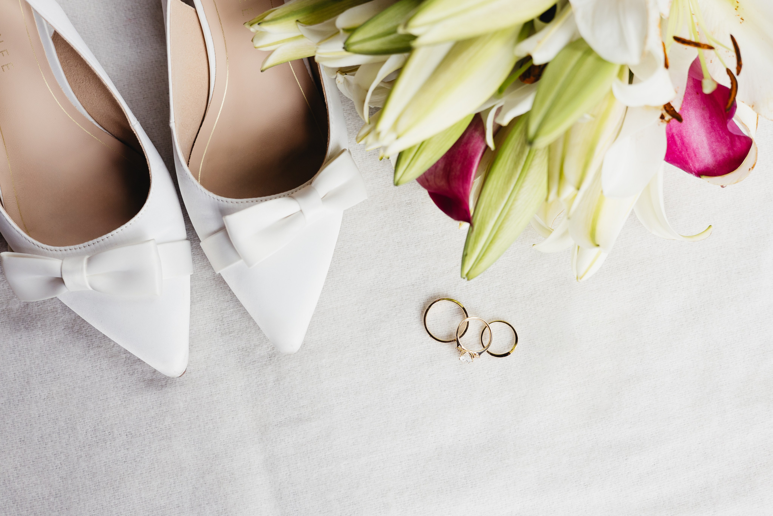Wedding details including shoes, bouquet, and rings