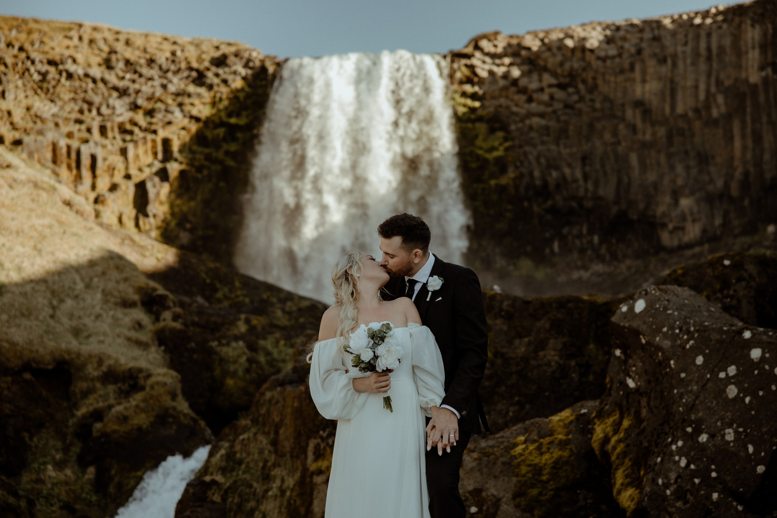 Iceland elopement at Budir with midnight sun wedding photos at black sand beach. Iceland elopement photographer & videographer