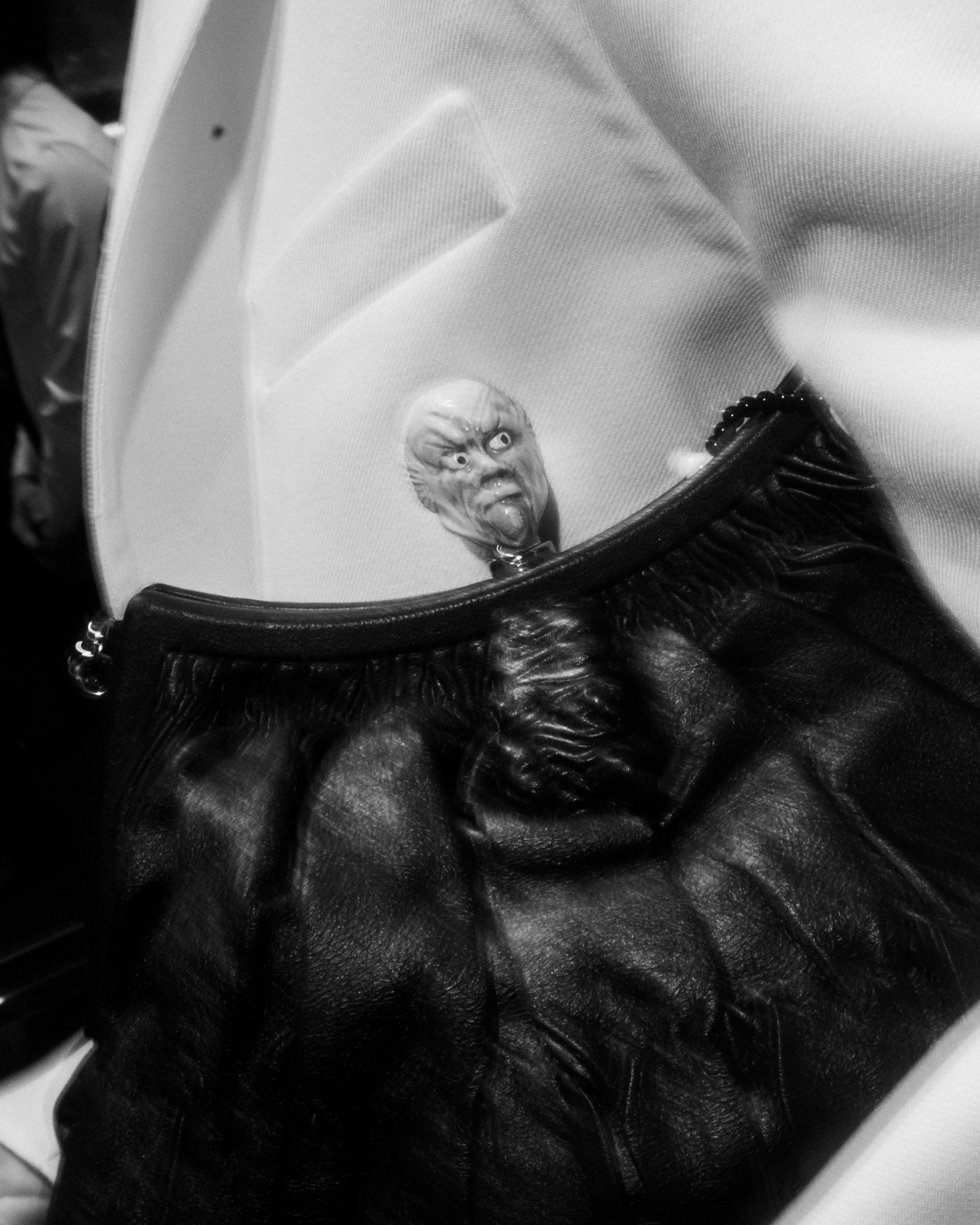 Designer handbag on reflective table – luxury product shot