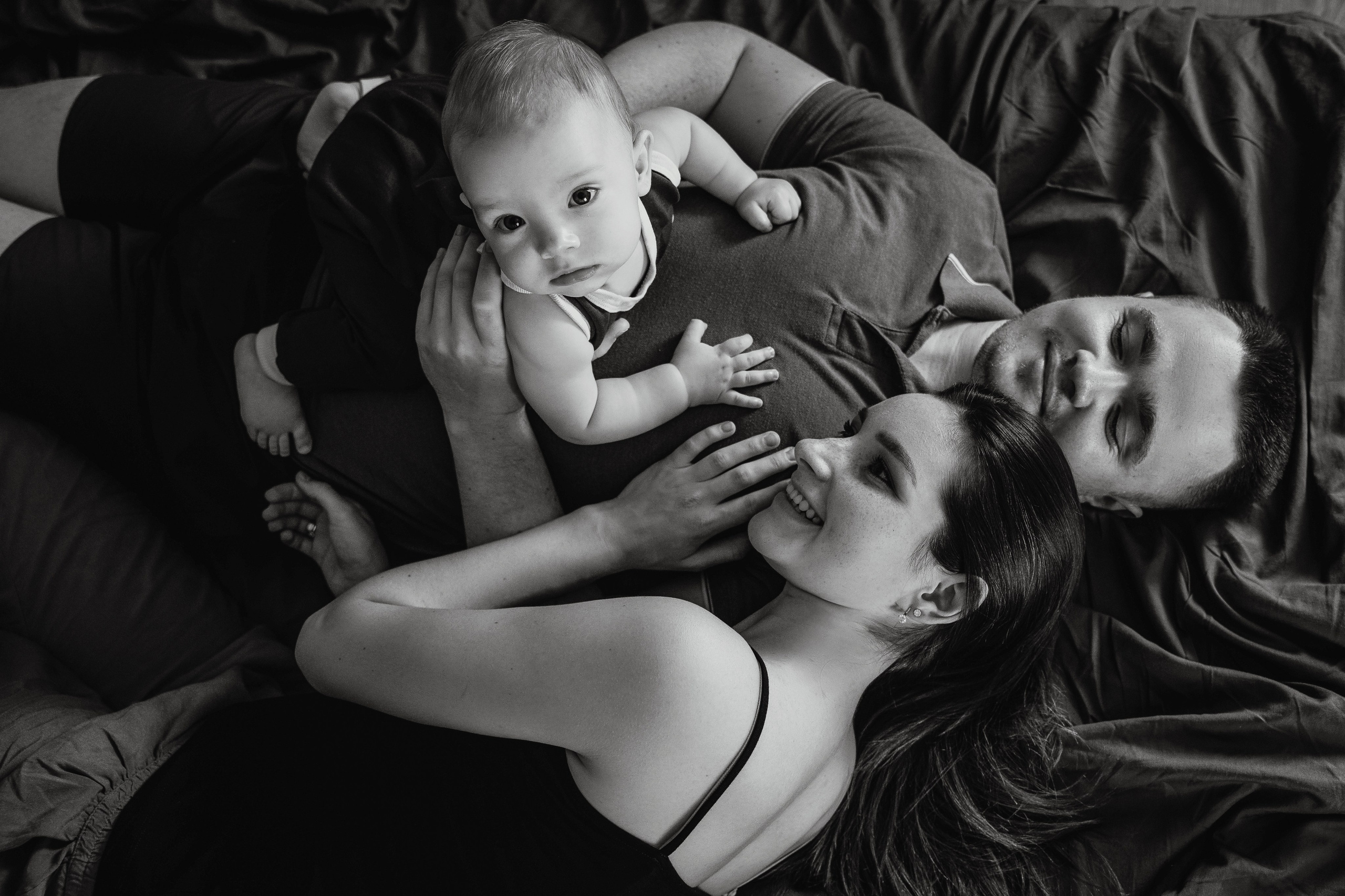 Adorable baby portraits capturing curiosity and first smiles in a natural home setting. Alisa Tant — Family and newborn photographer Bucks County, Montgomery county, Philadelphia, NJ