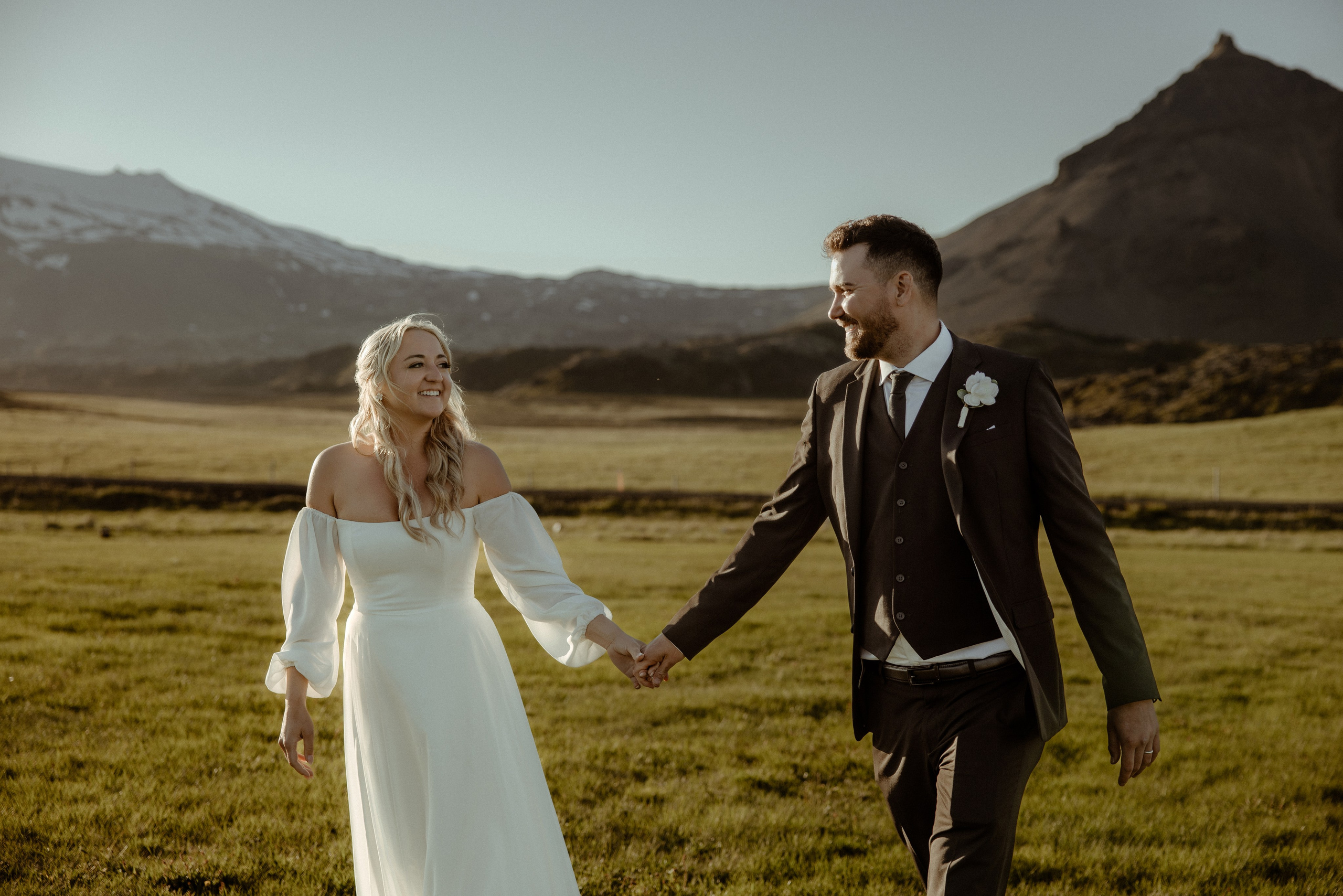 Iceland elopement at Budir with midnight sun wedding photos at black sand beach. Iceland elopement photographer & videographer