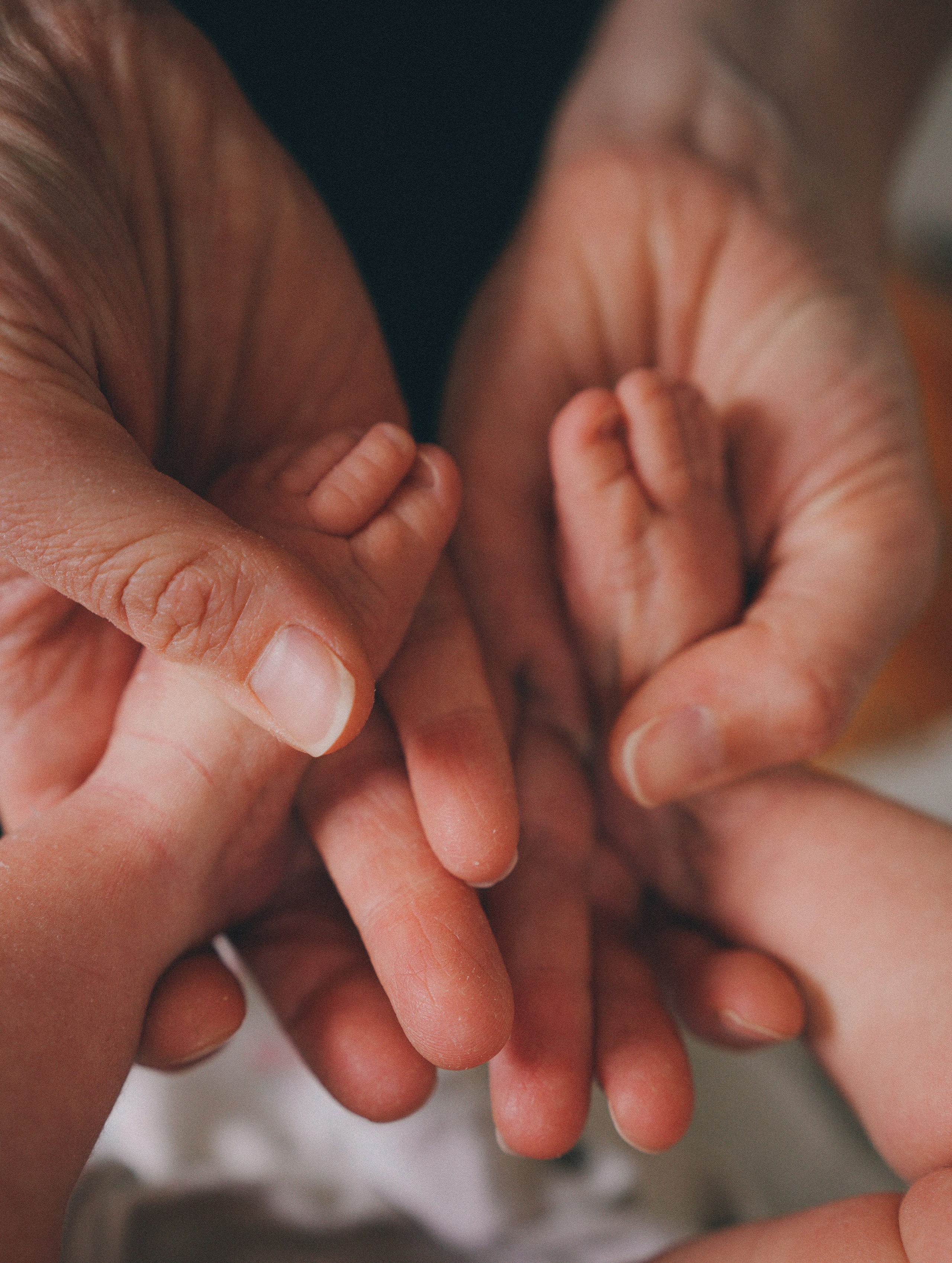 Close-up details of newborn baby feet during a natural at-home newborn photo session.