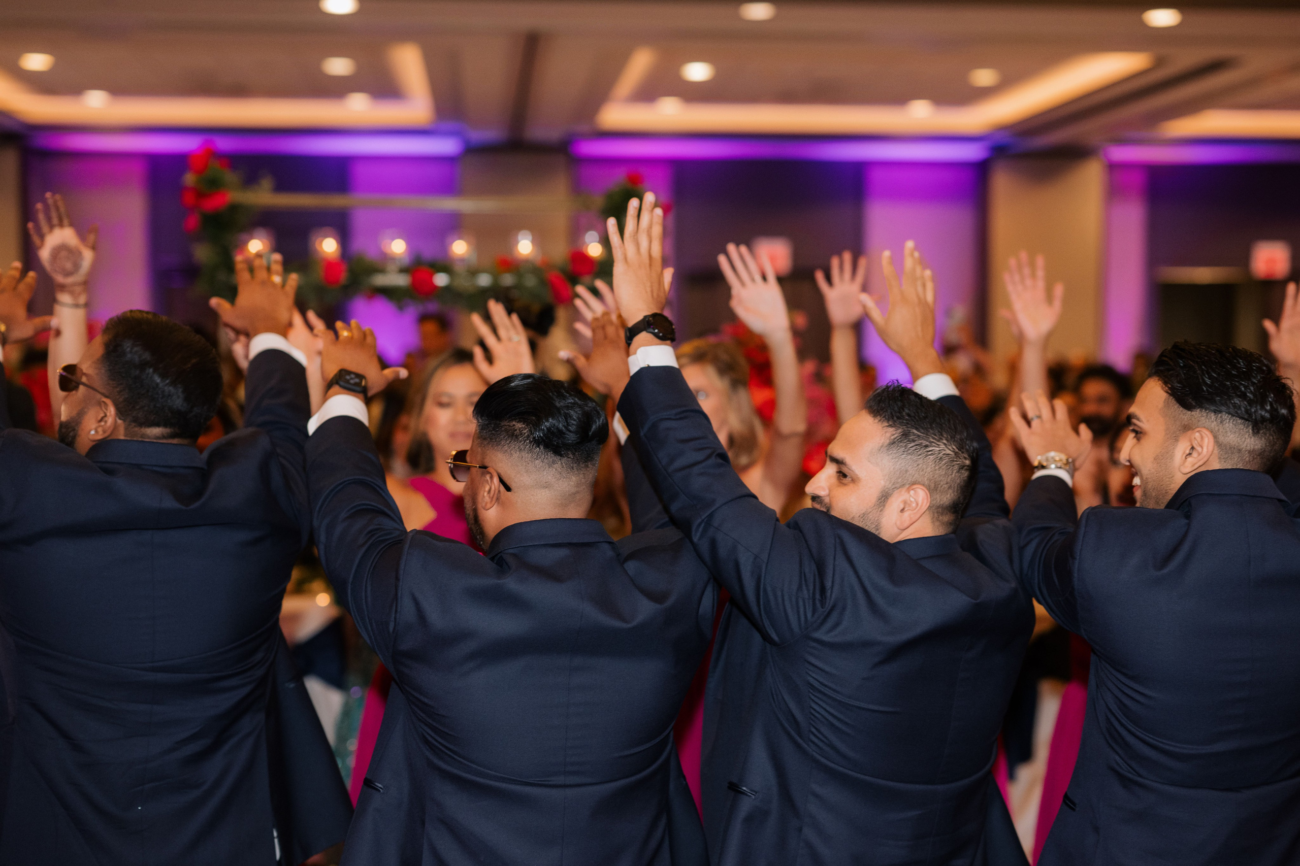 a group of people in suits and ties dancing