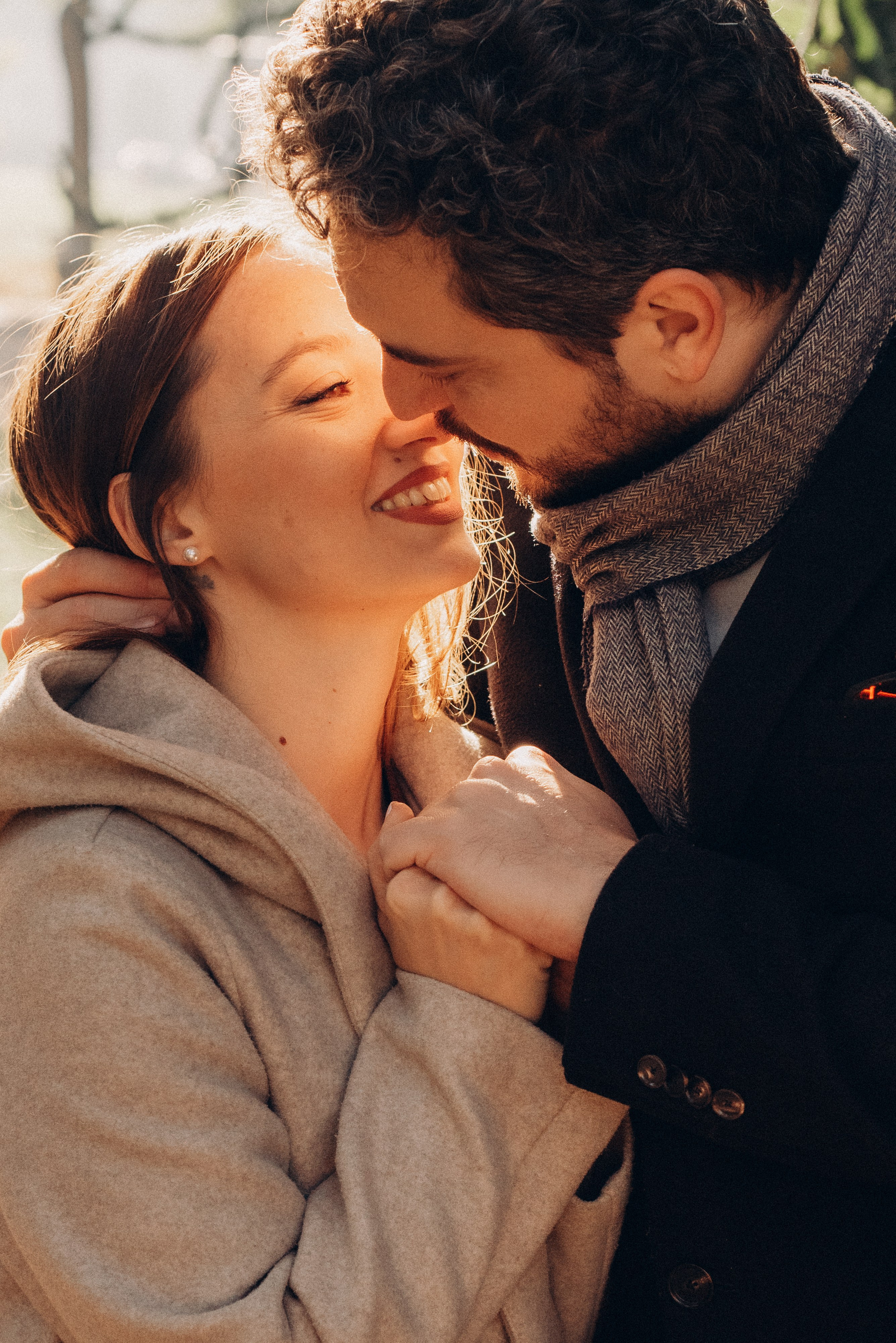 Romantic scene of a couple sharing a quiet moment in a Milan square at sunset. Couple photographer in Milan. Proposal photoshoot Milan. Engagement photoshoot Milan
