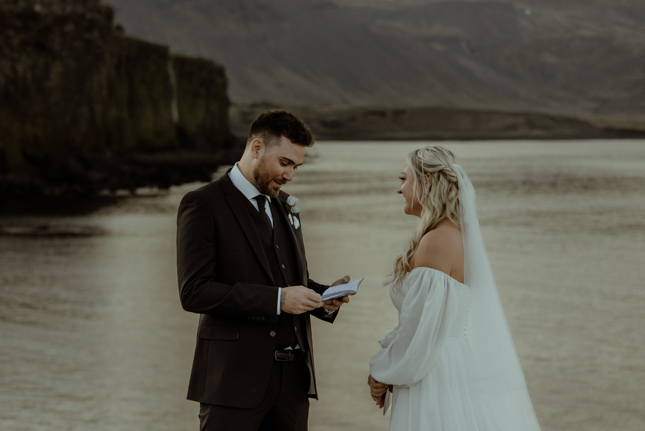 Iceland elopement at Budir with midnight sun wedding photos at black sand beach. Iceland elopement photographer & videographer