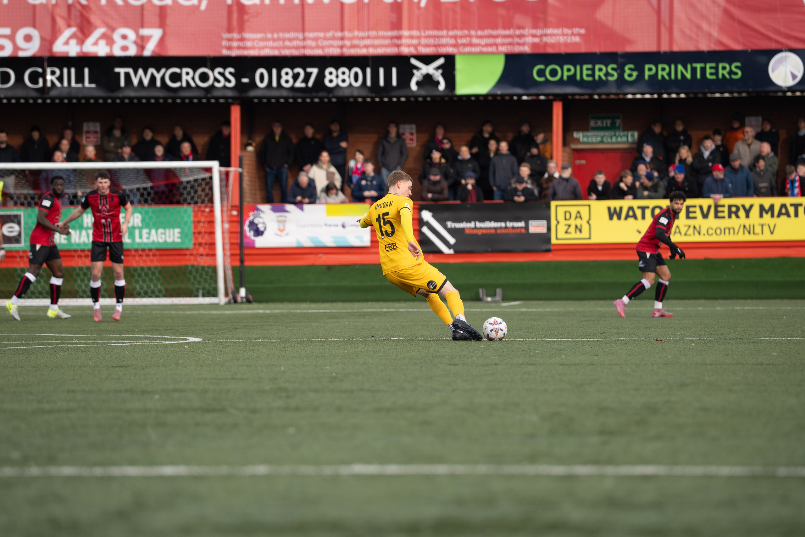 Tamworth, England — February 14, 2026: An Aldershot Town player lines up a shot during the Enterprise National League match between Tamworth FC and Aldershot Town at The Lamb Ground. Photo: Jay Soundo