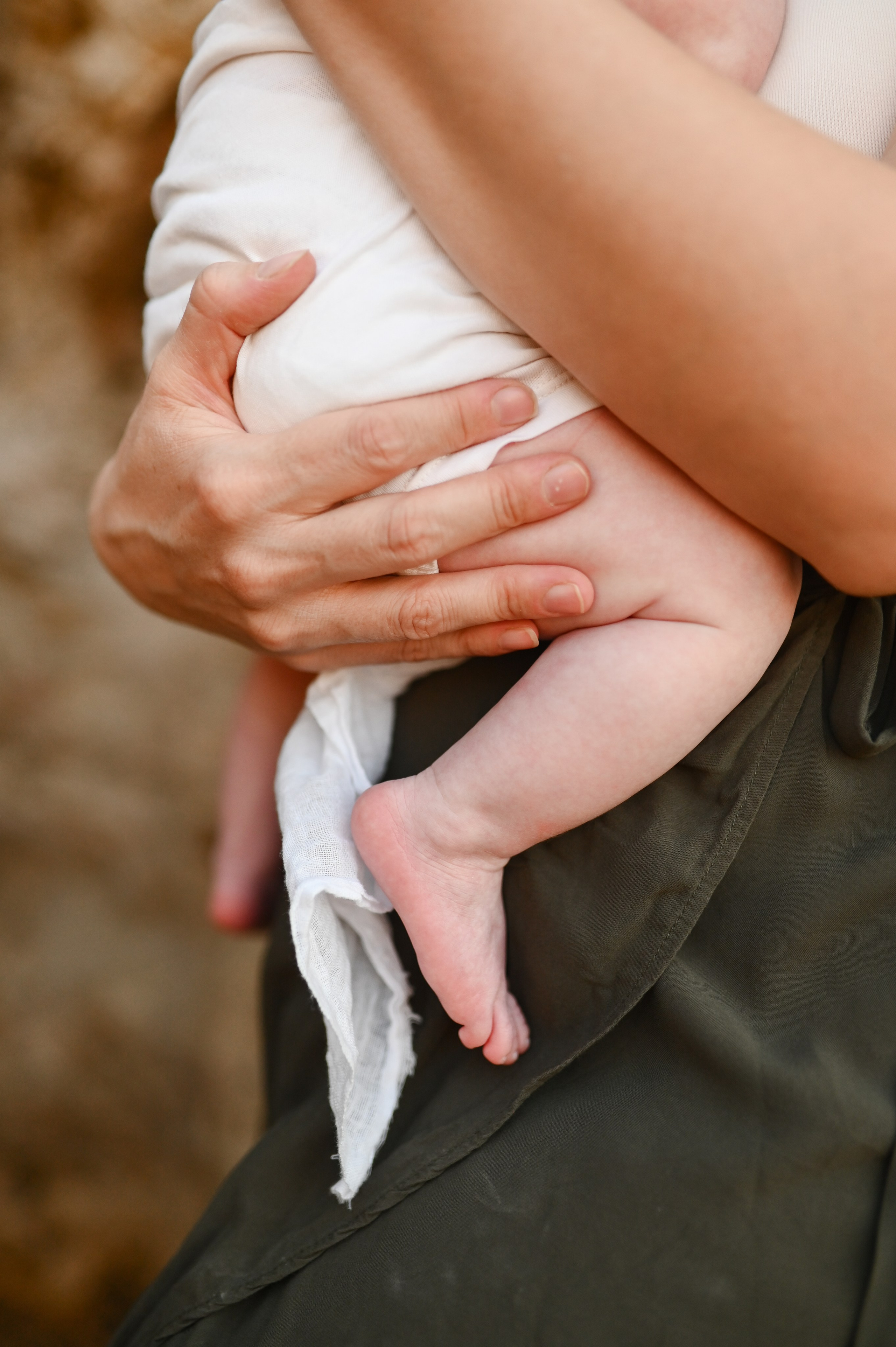 Happy family walking along a Rhodes beach at sunset. Photographer in Rhodes Island