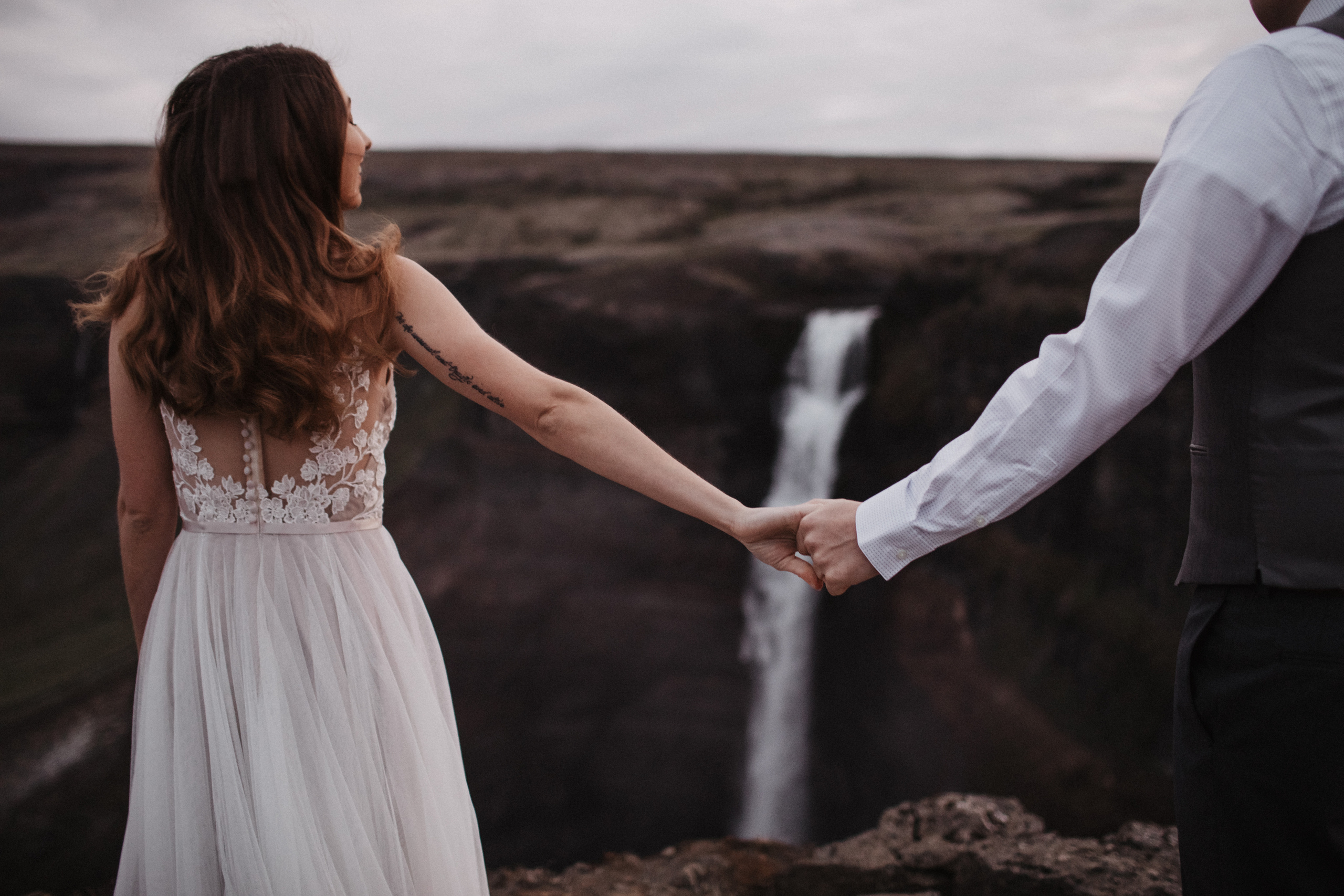 Midnight sun elopement at Haifoss in Iceland. Iceland elopement photographer & videographer