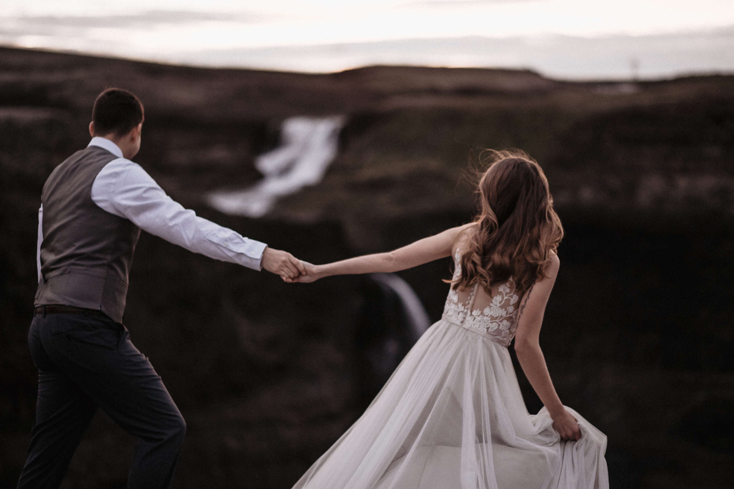Midnight sun elopement at Haifoss in Iceland. Iceland elopement photographer & videographer