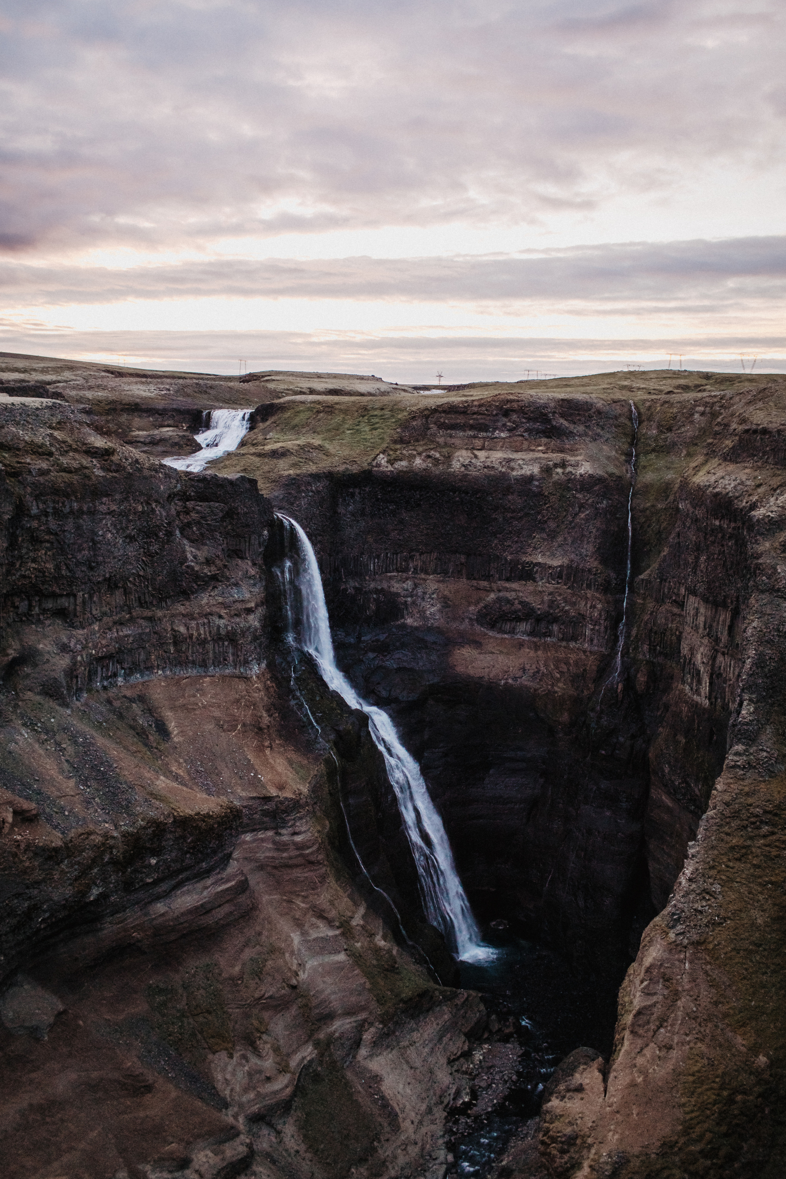 Midnight sun elopement at Haifoss in Iceland. Iceland elopement photographer & videographer