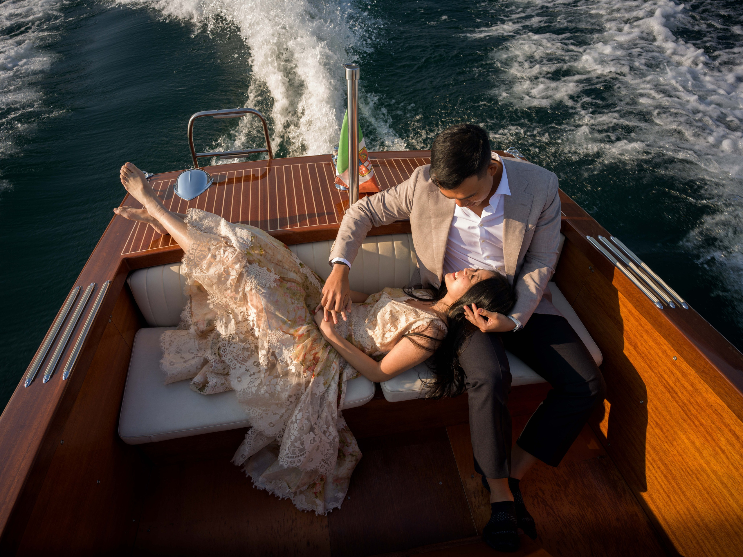 Engagement moment on Lake Garda with Isola del Garda view.