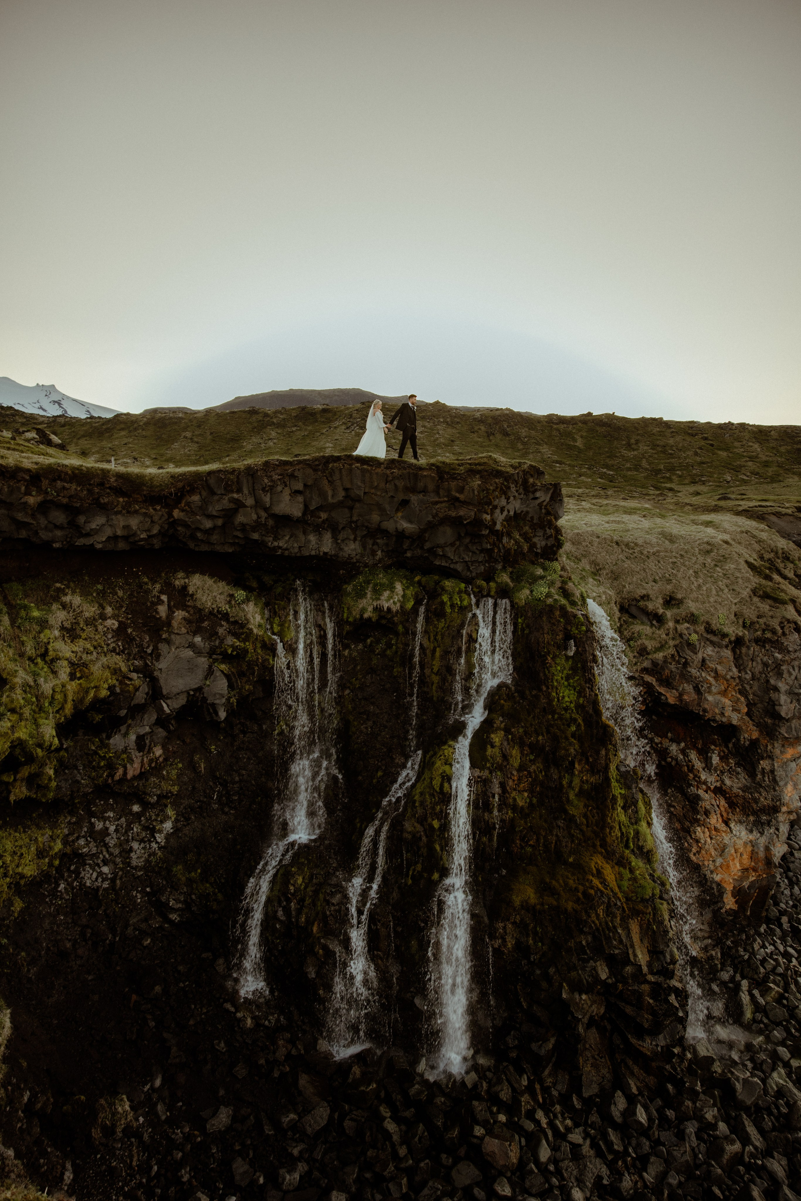 Iceland elopement at Budir with midnight sun wedding photos at black sand beach. Iceland elopement photographer & videographer