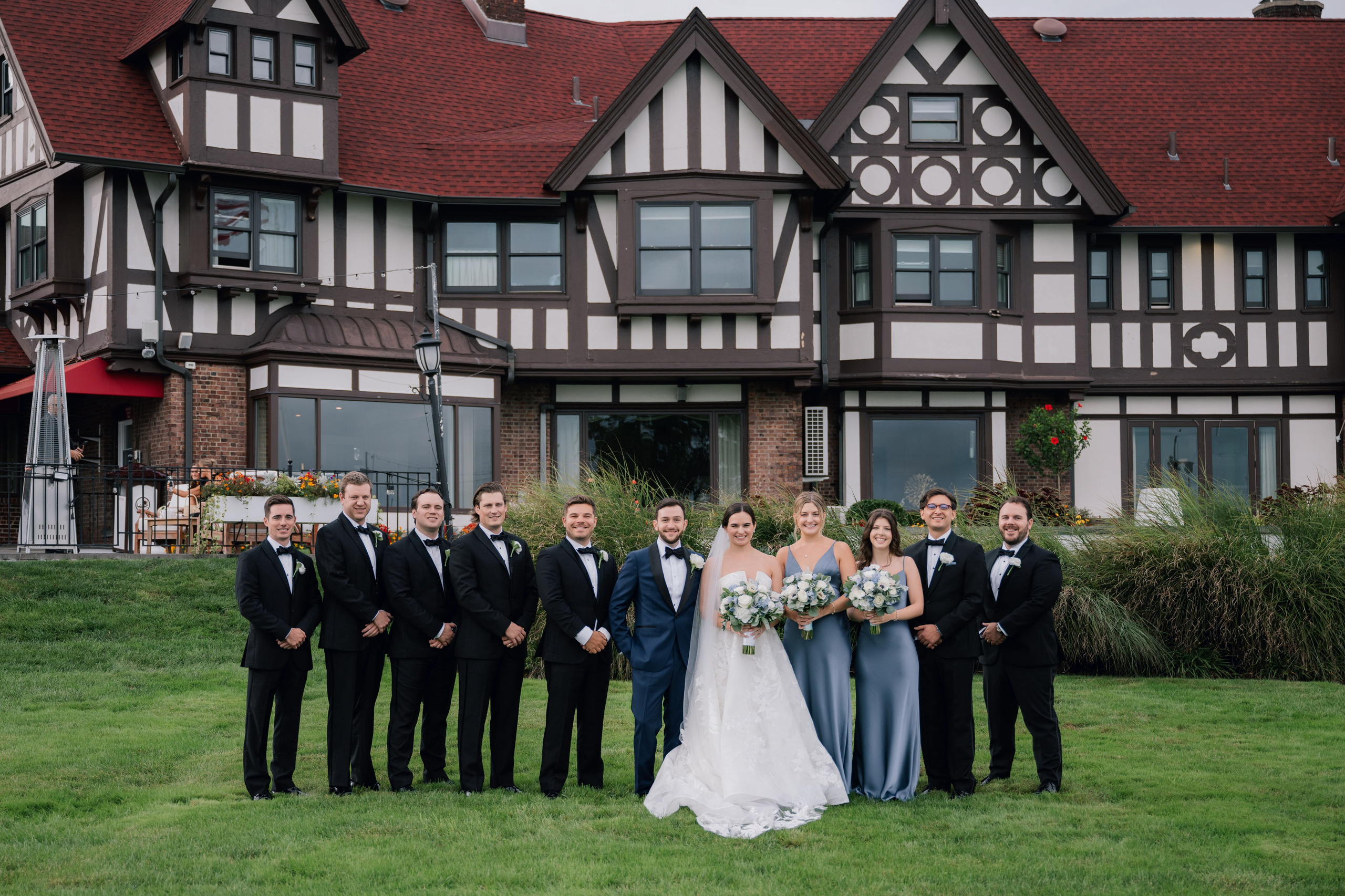 a group of people standing in front of a house