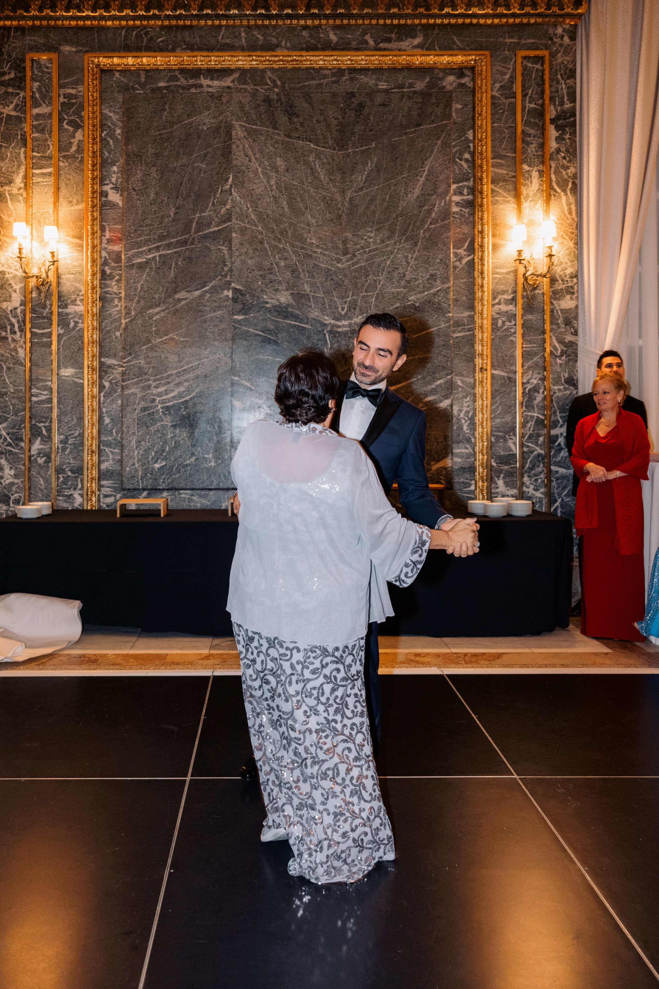 a man and woman dancing on a dance floor