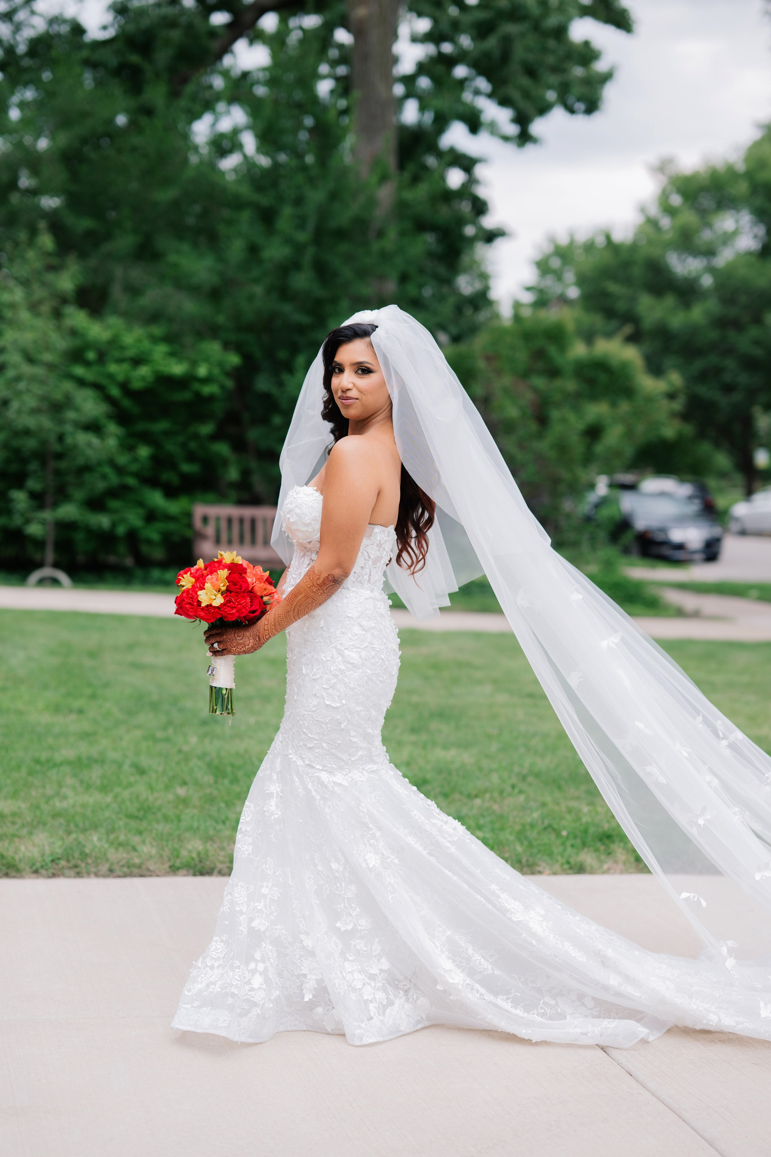 a bride in a wedding dress holding a bouquet