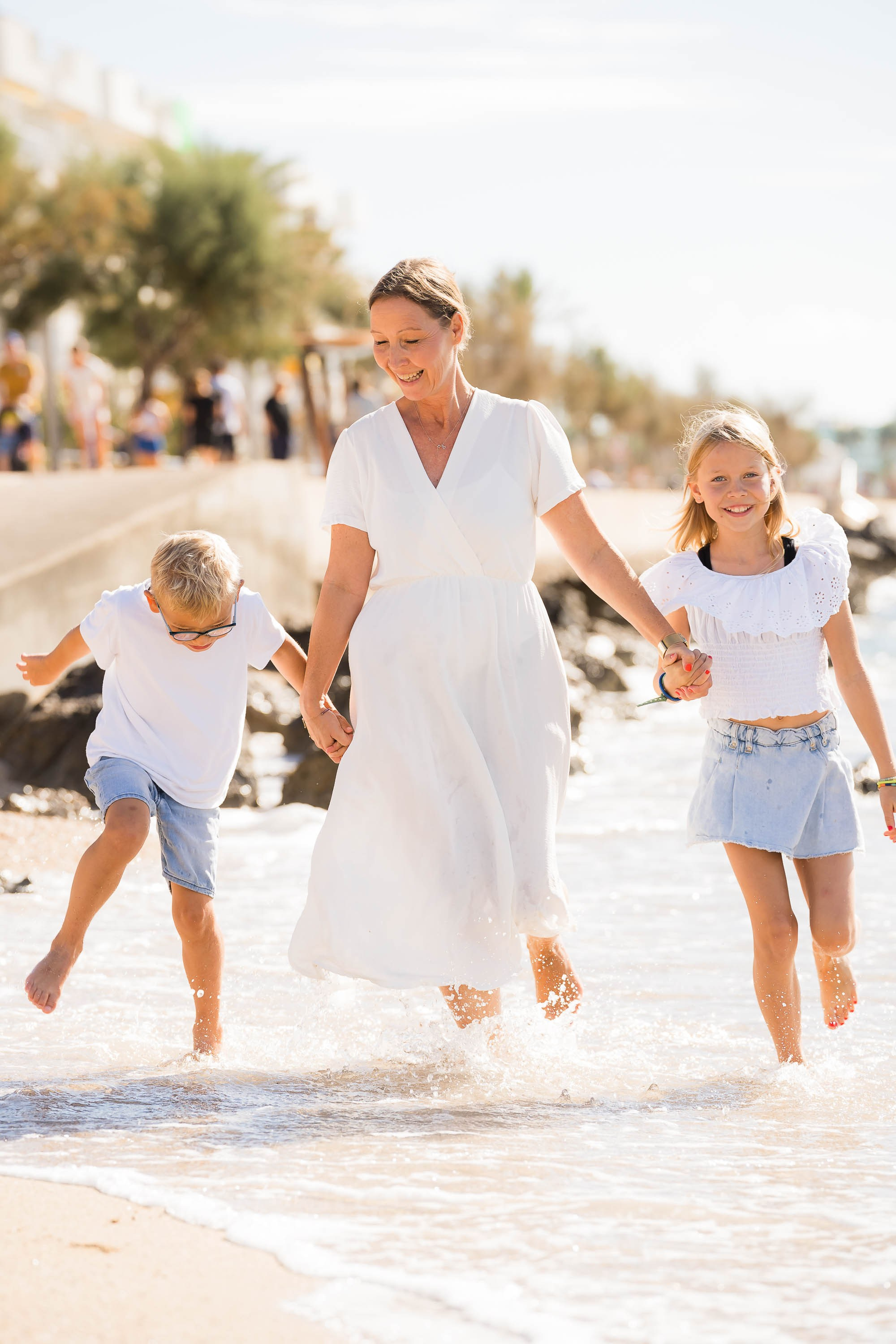 Family Portraits playing by the sea in Mallorca