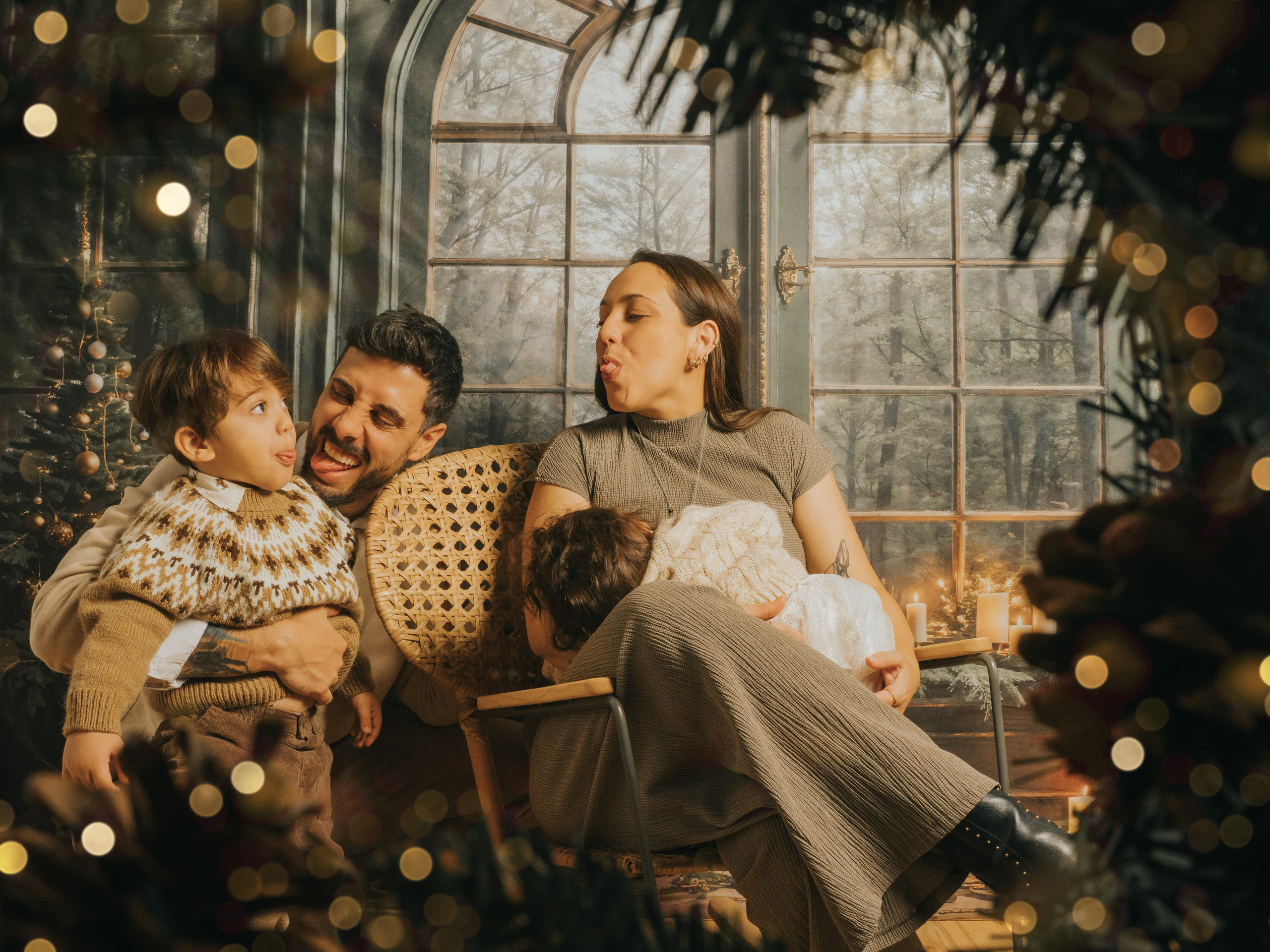Christmas Mini Session of family of four, woman is breastfeeding.