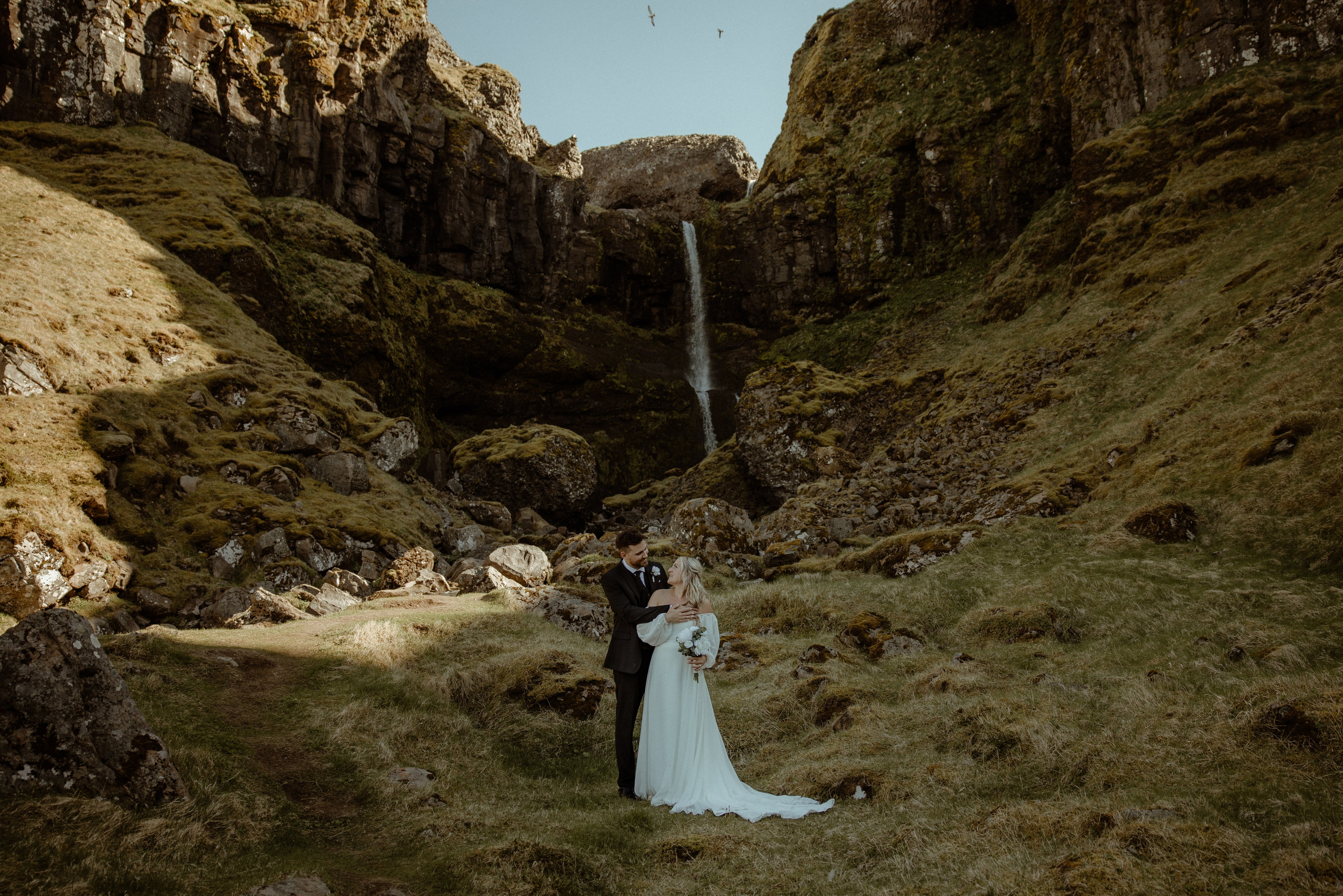 Iceland elopement at Budir with midnight sun wedding photos at black sand beach. Iceland elopement photographer & videographer