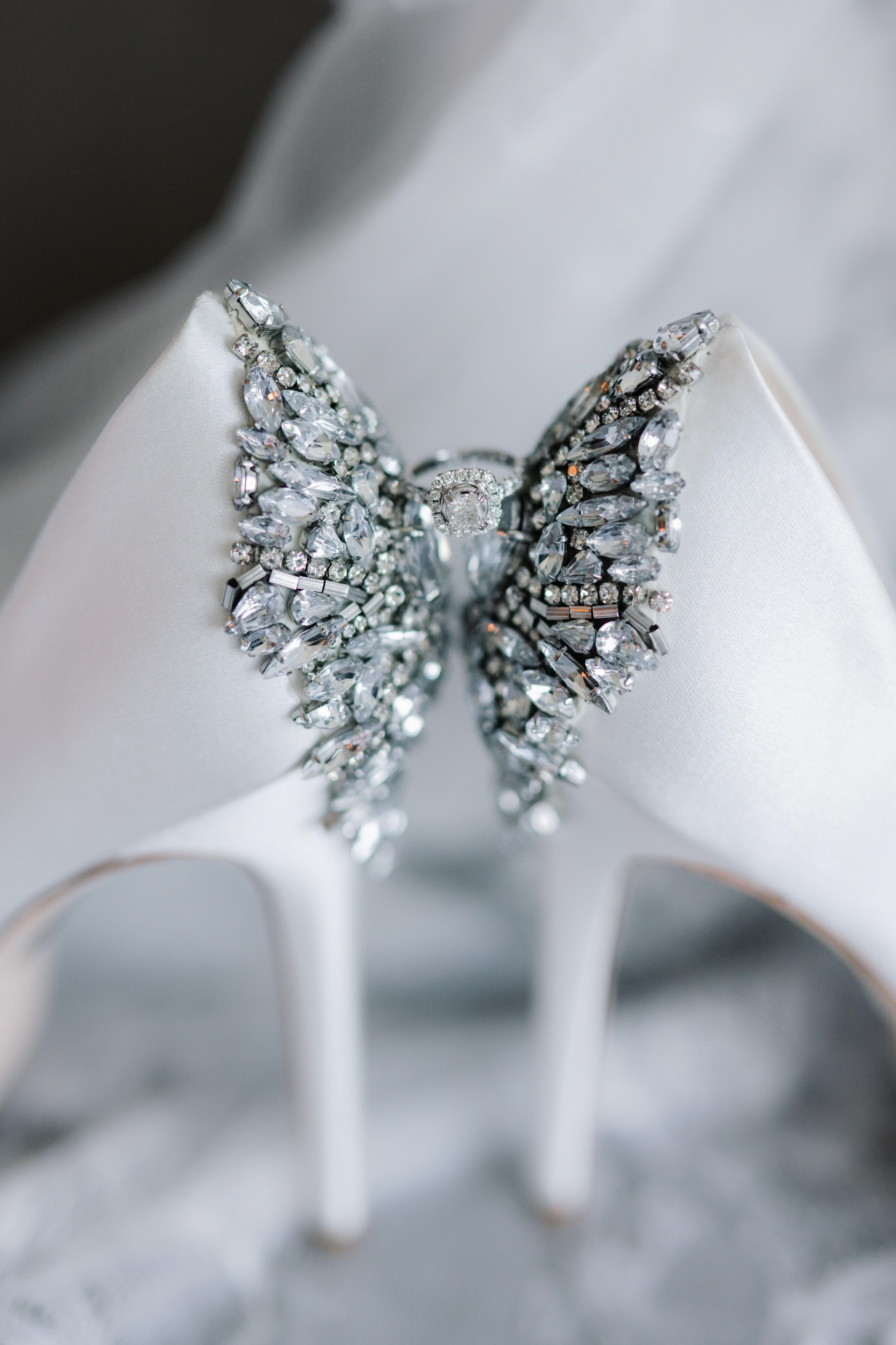 a pair of shoes with a butterfly on them