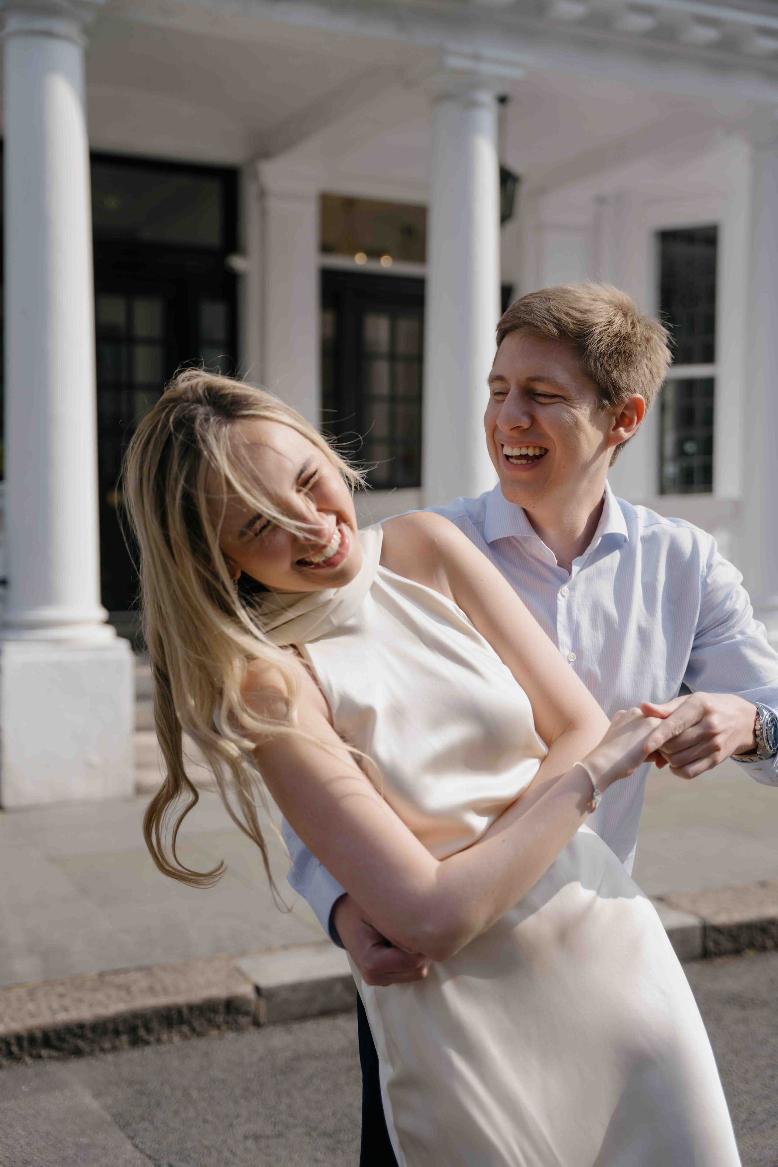 Natural candid moment of a couple smiling during London photoshoot