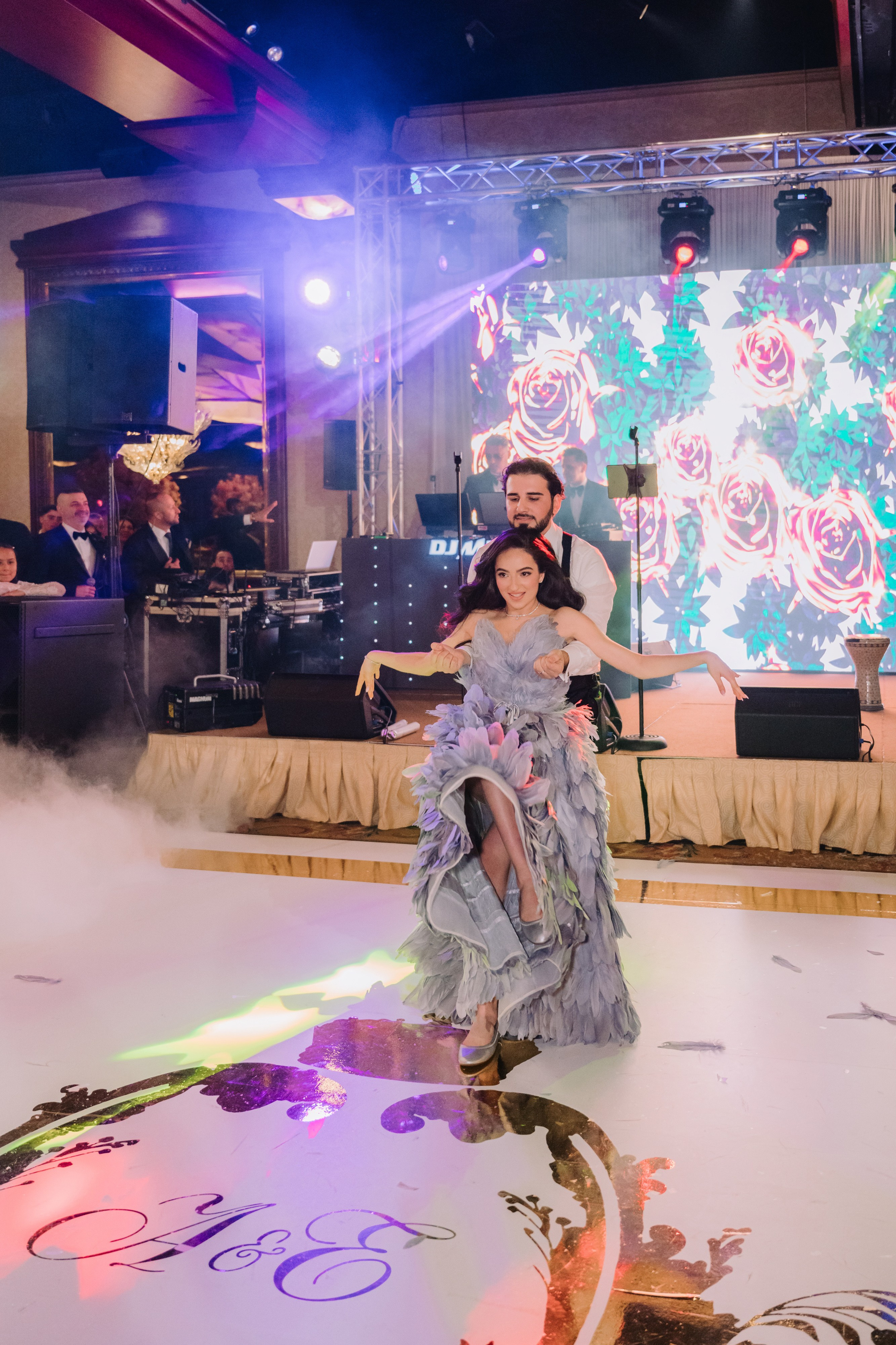 a woman in a dress dancing on a dance floor