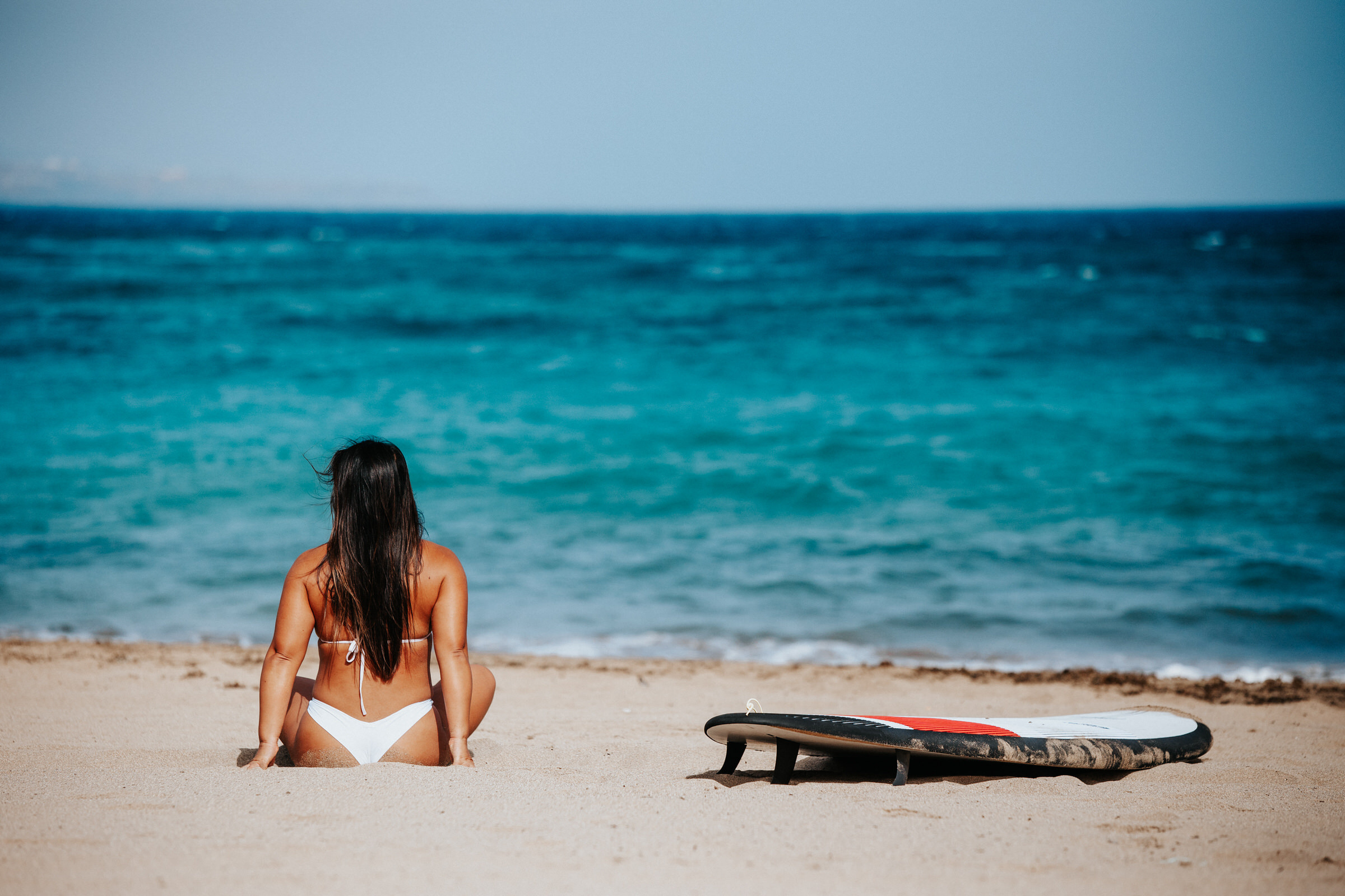 Discover the captivating beauty of Gran Canaria through the lens of a talented photographer, showcasing stunning beach scenes with a touch of surf culture.