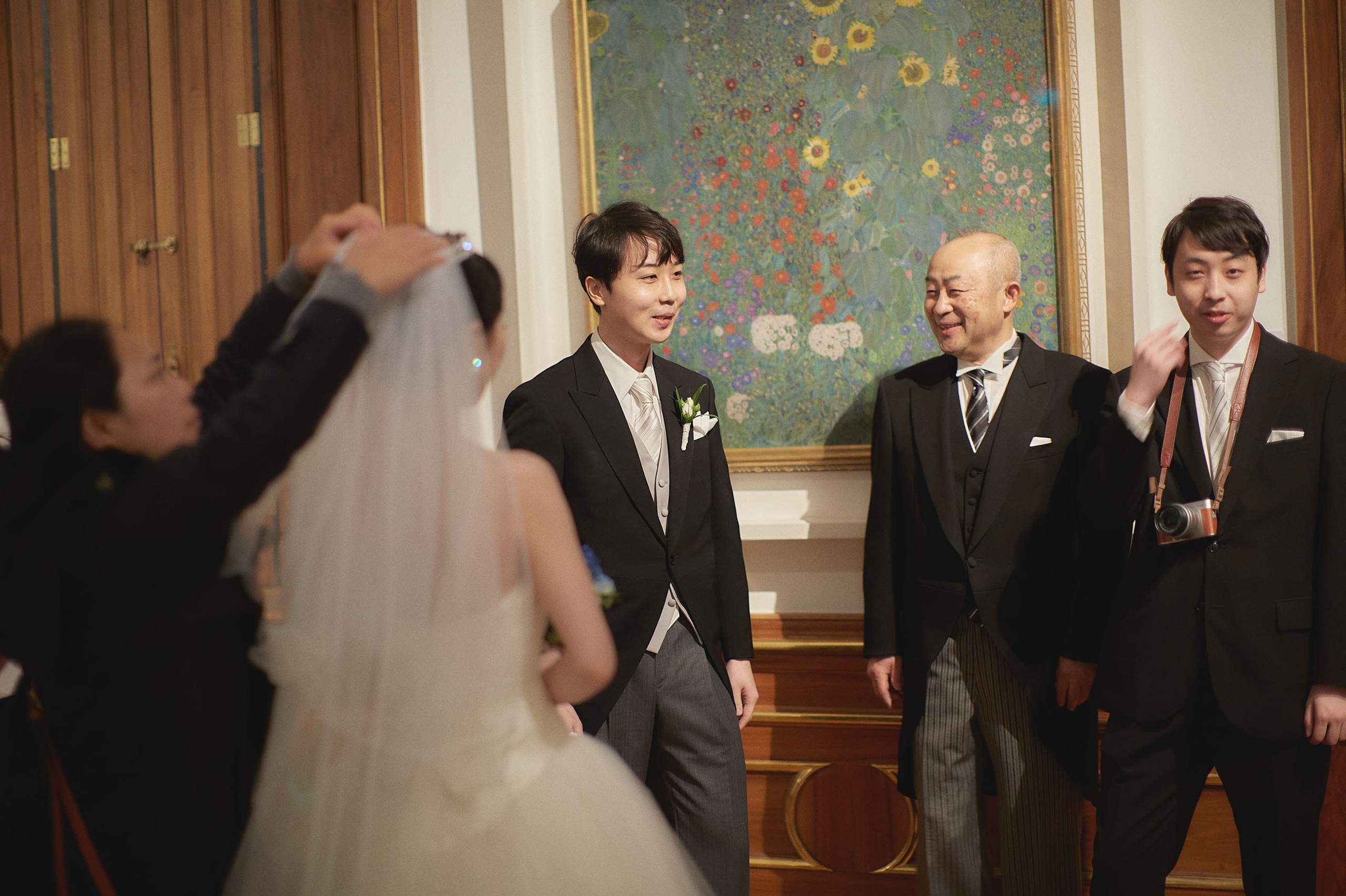 The bride and groom with their family members wait to enter the ceremonial hall at the Belvedere Palace.