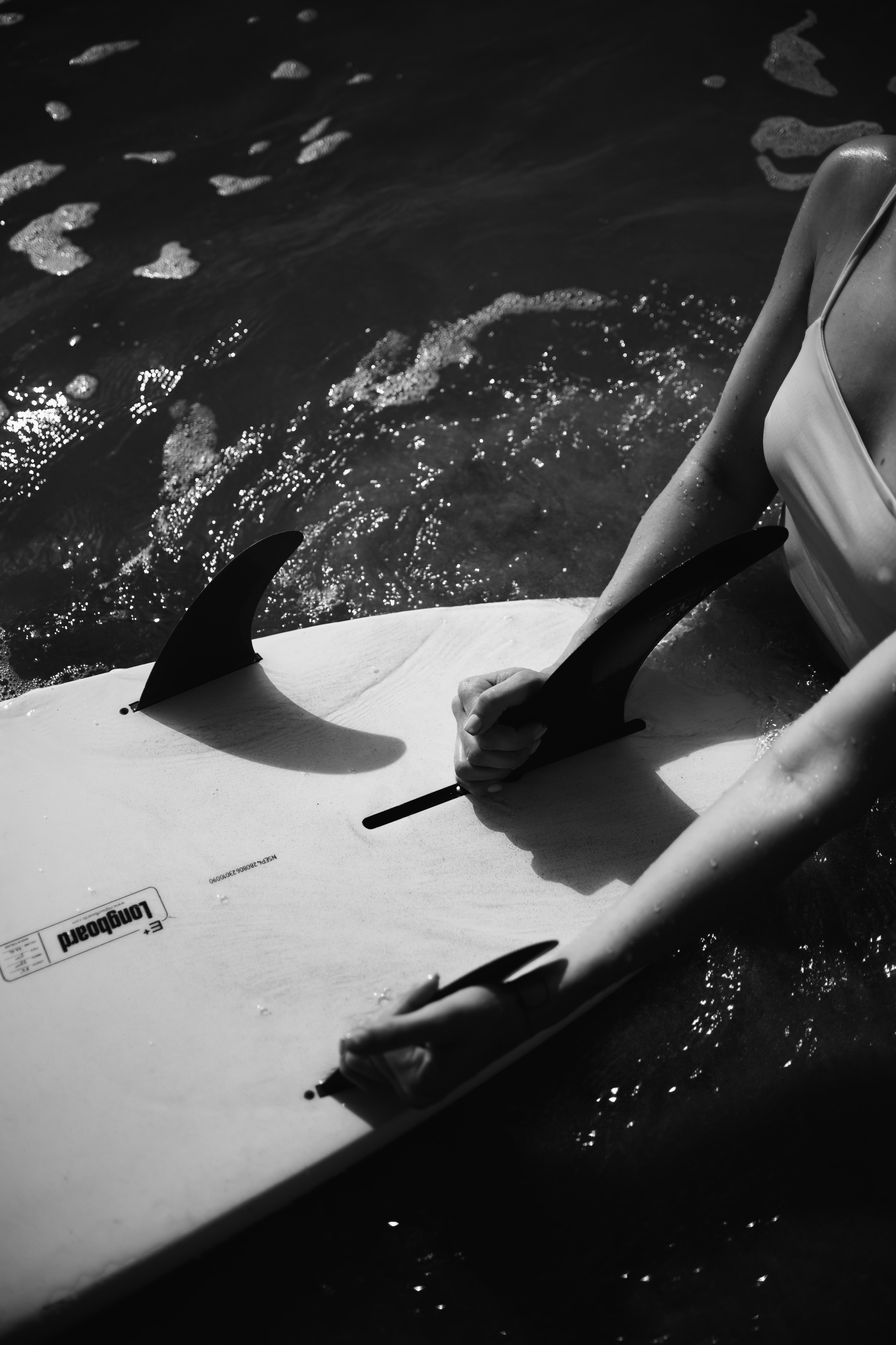 Photoshoot with a surfboard | BW