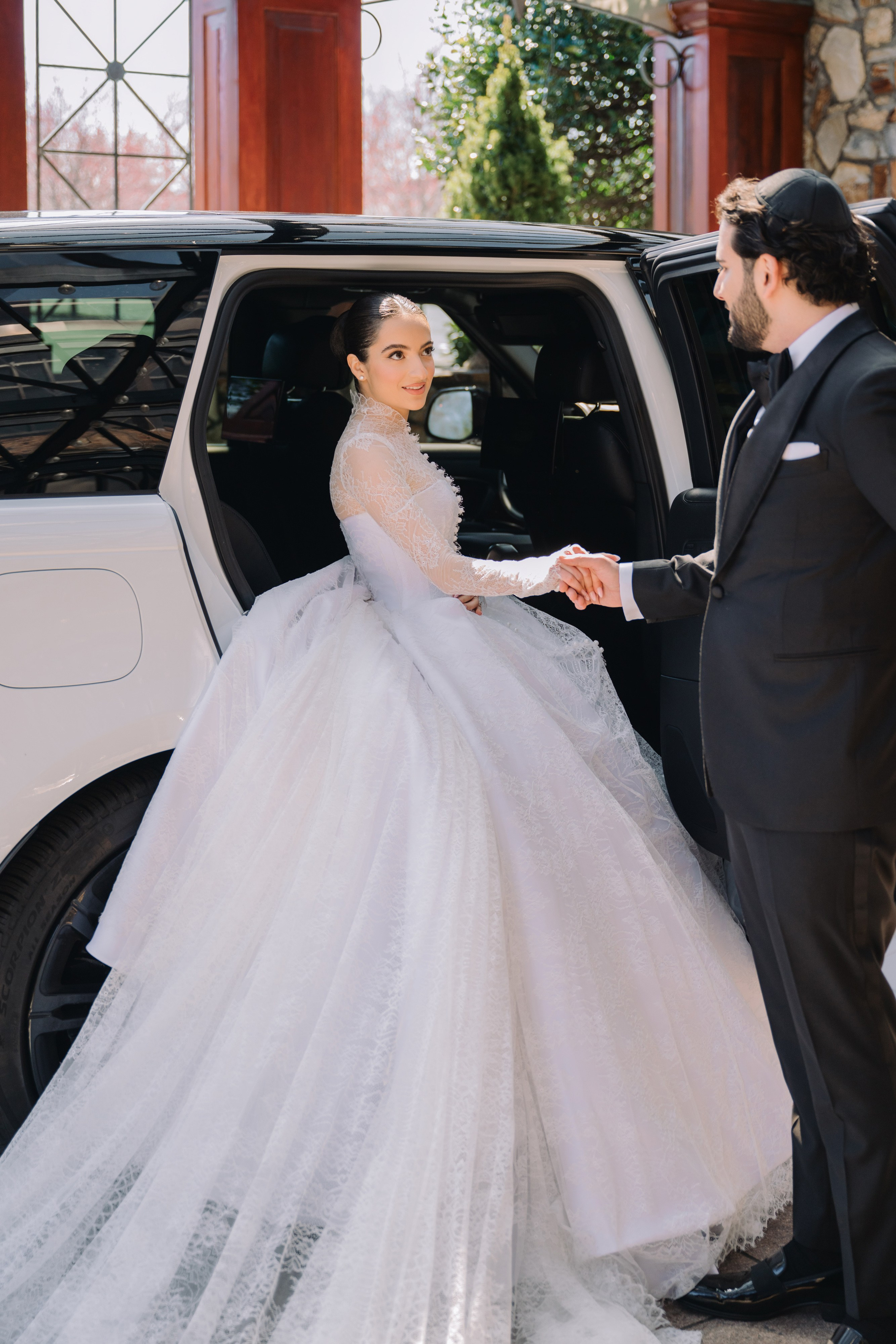 a bride getting into her car