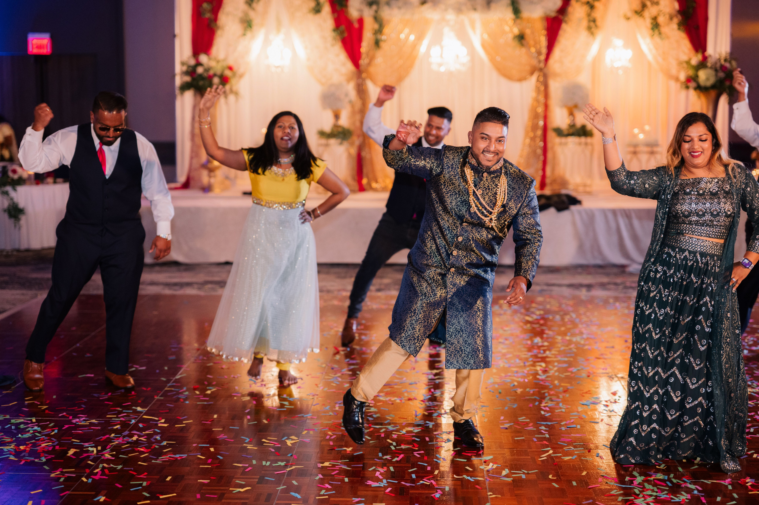 a group of people dancing on a dance floor