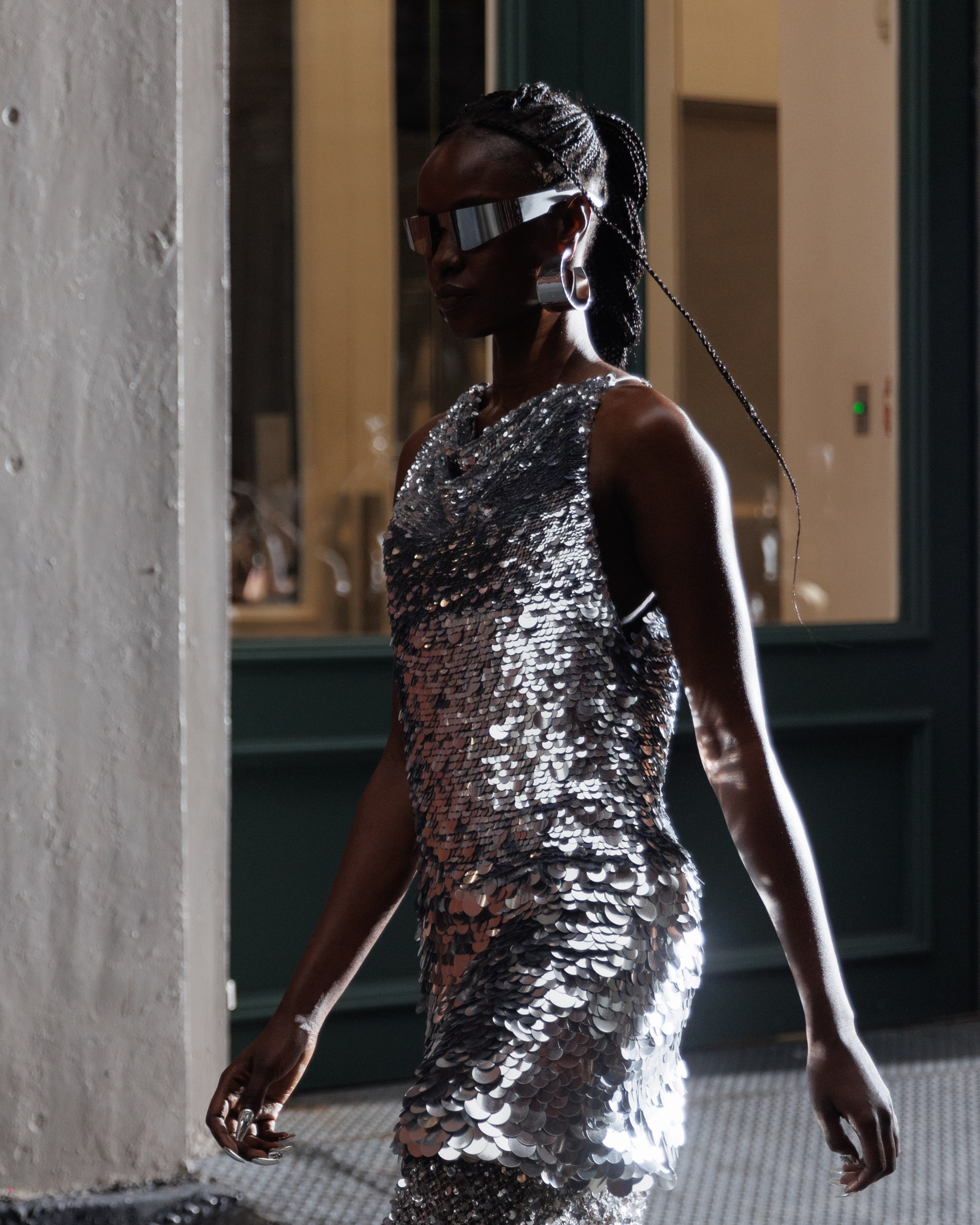 Fashion model walking outdoors in silver outfit – street style NYC