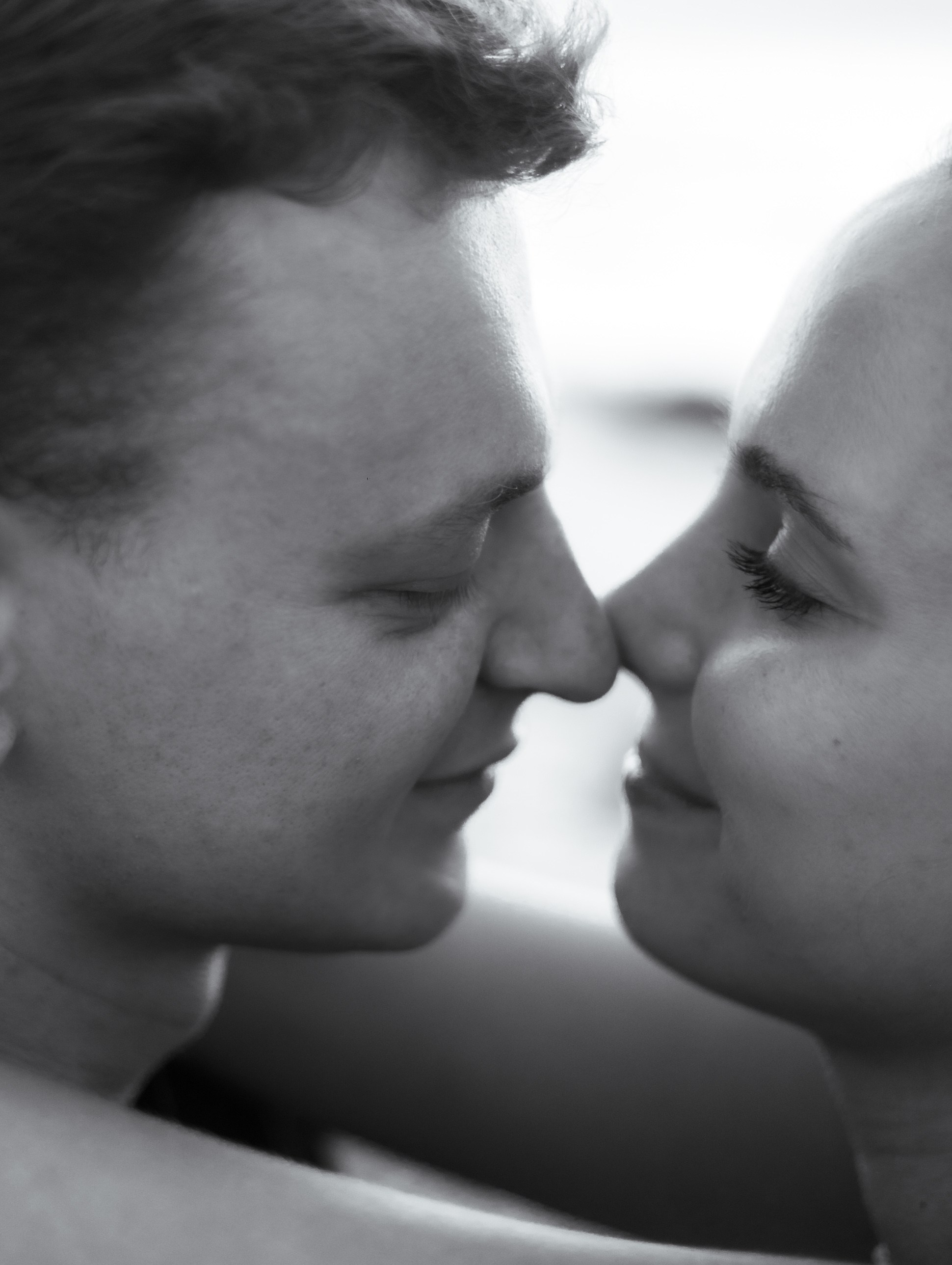 Close-up portrait of a couple about to kiss