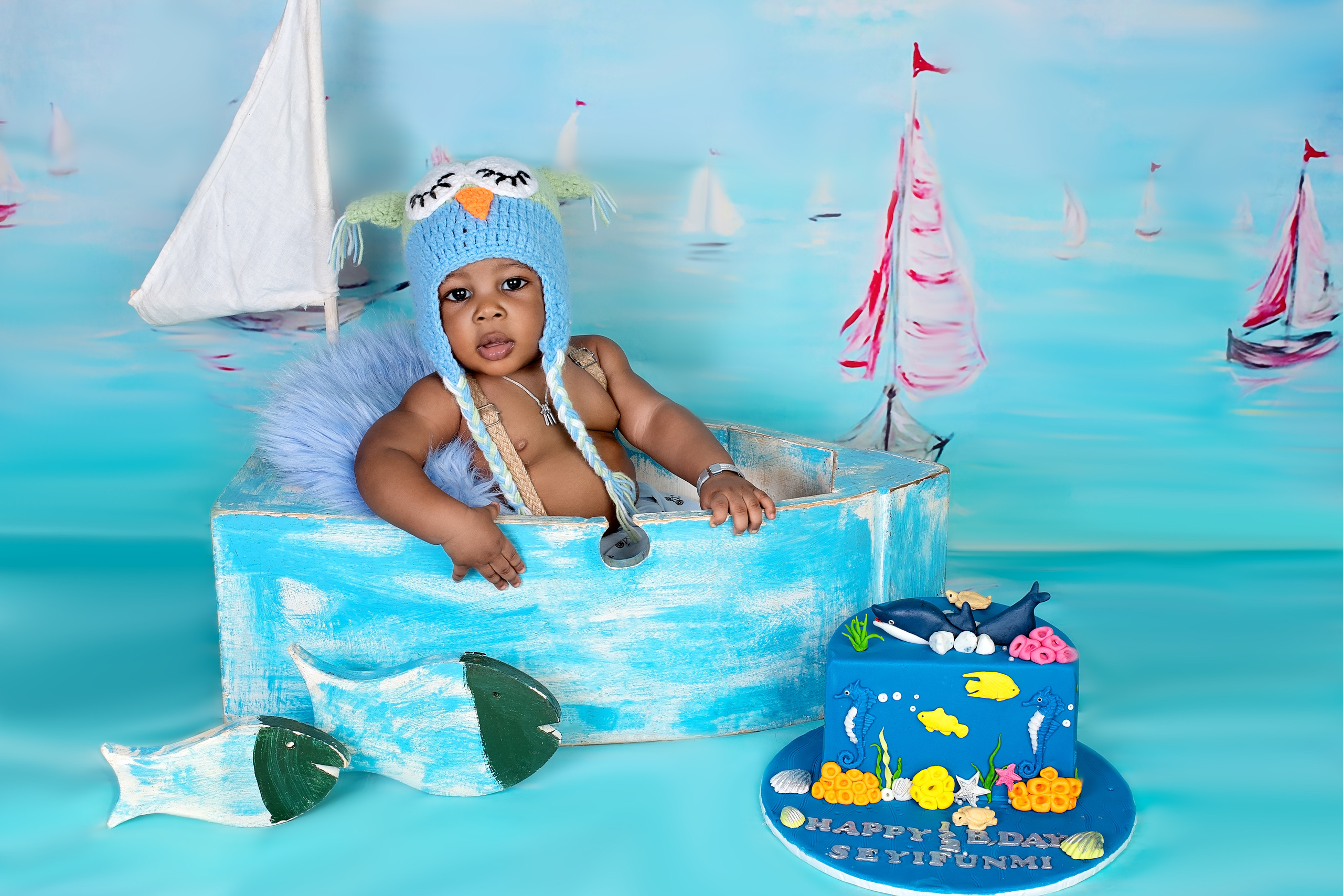 Nigerian 6 months baby boy in the blue boat photo shoot